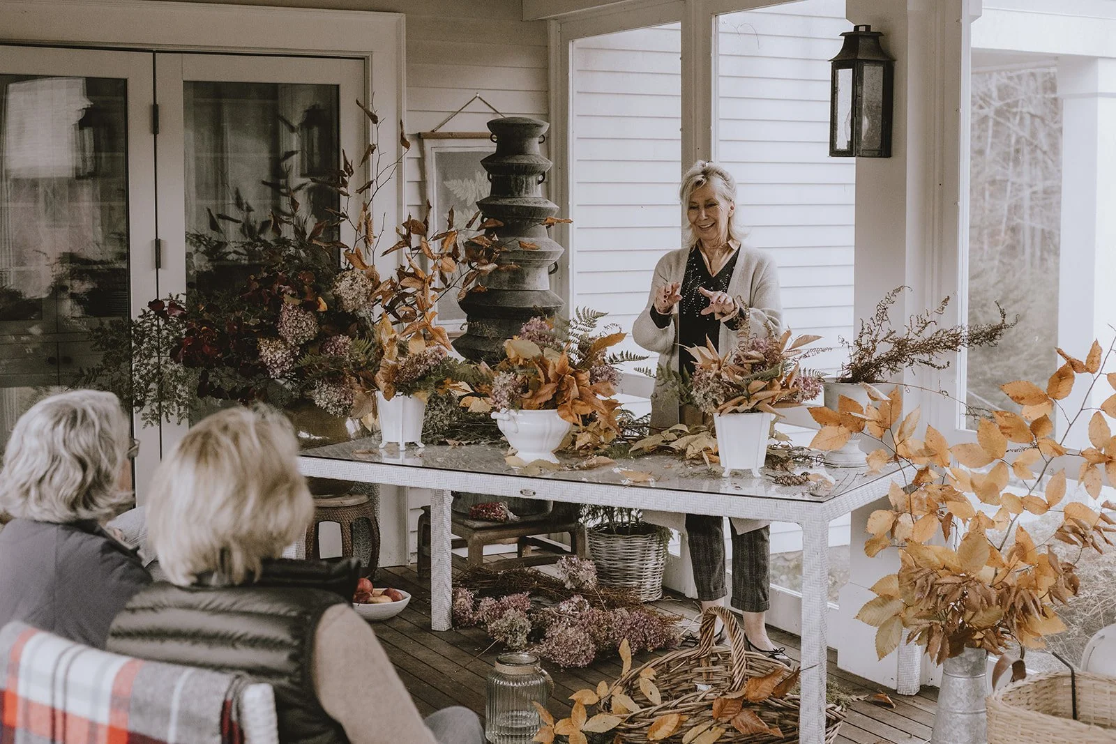 Sharon Santoni of My French Country Home Magazine demonstrating flower arranging for guests at the Reinvention gathering at Tahilla Farm in Peterborough, New Hampshire