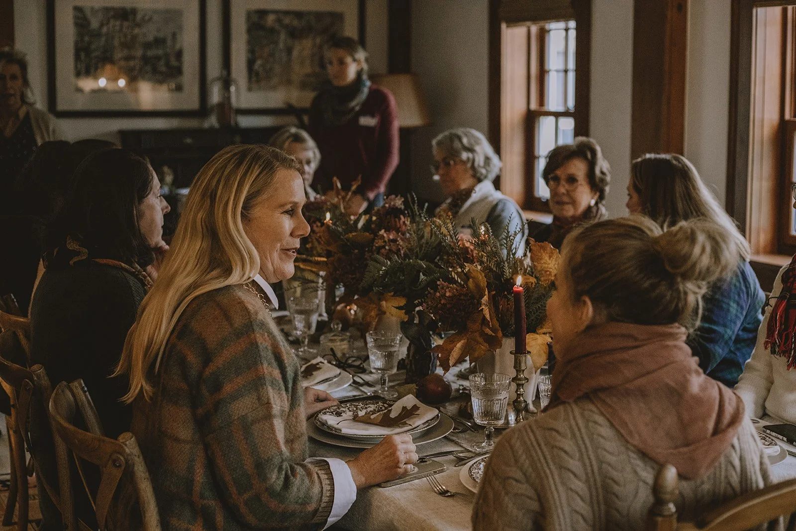 Guests gathered around the table at the Reinvention weekend hosted by Jeanne Henriques and Sharon Santoni at Tahilla Farm in Peterborough, New Hampshire