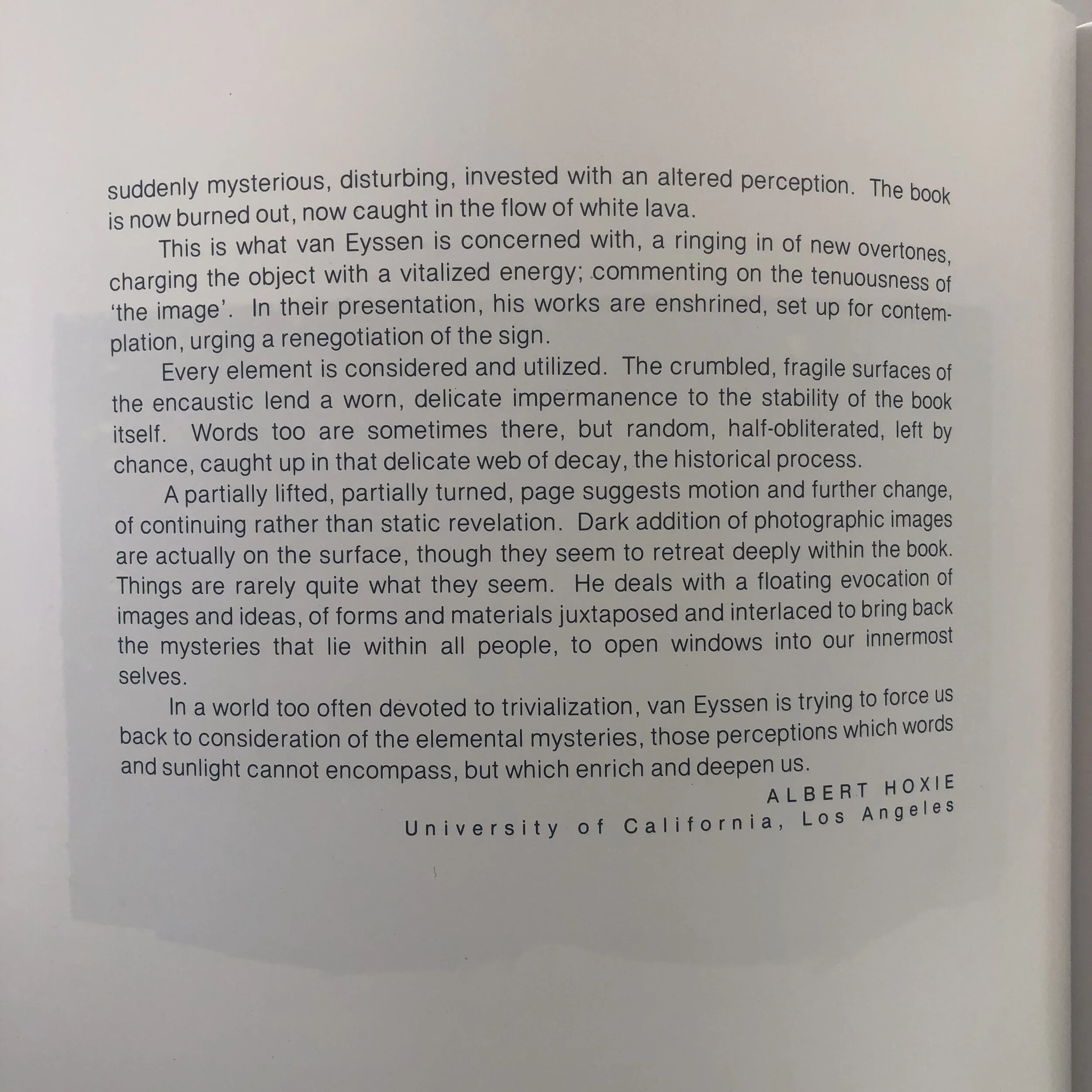 A close-up of a page from a book containing text about van Eyssen's work, discussing themes of altered perception, impermanence, and mystery in his art. The text is authored by Albert Hoxie from the University of California, Los Angeles.