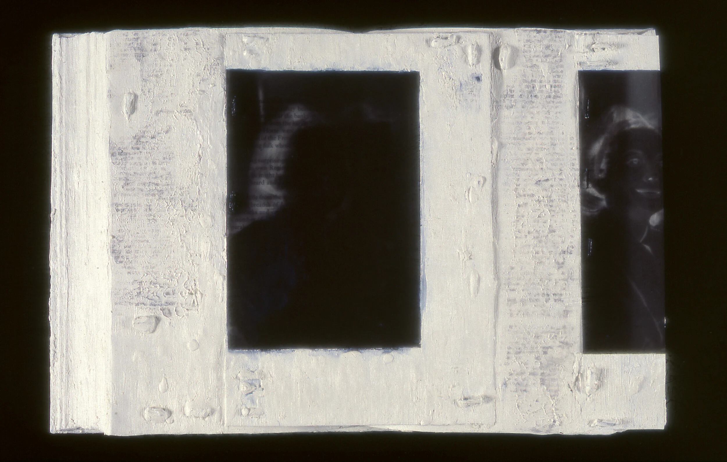 Abstract artwork with textured white frame and dark silhouettes