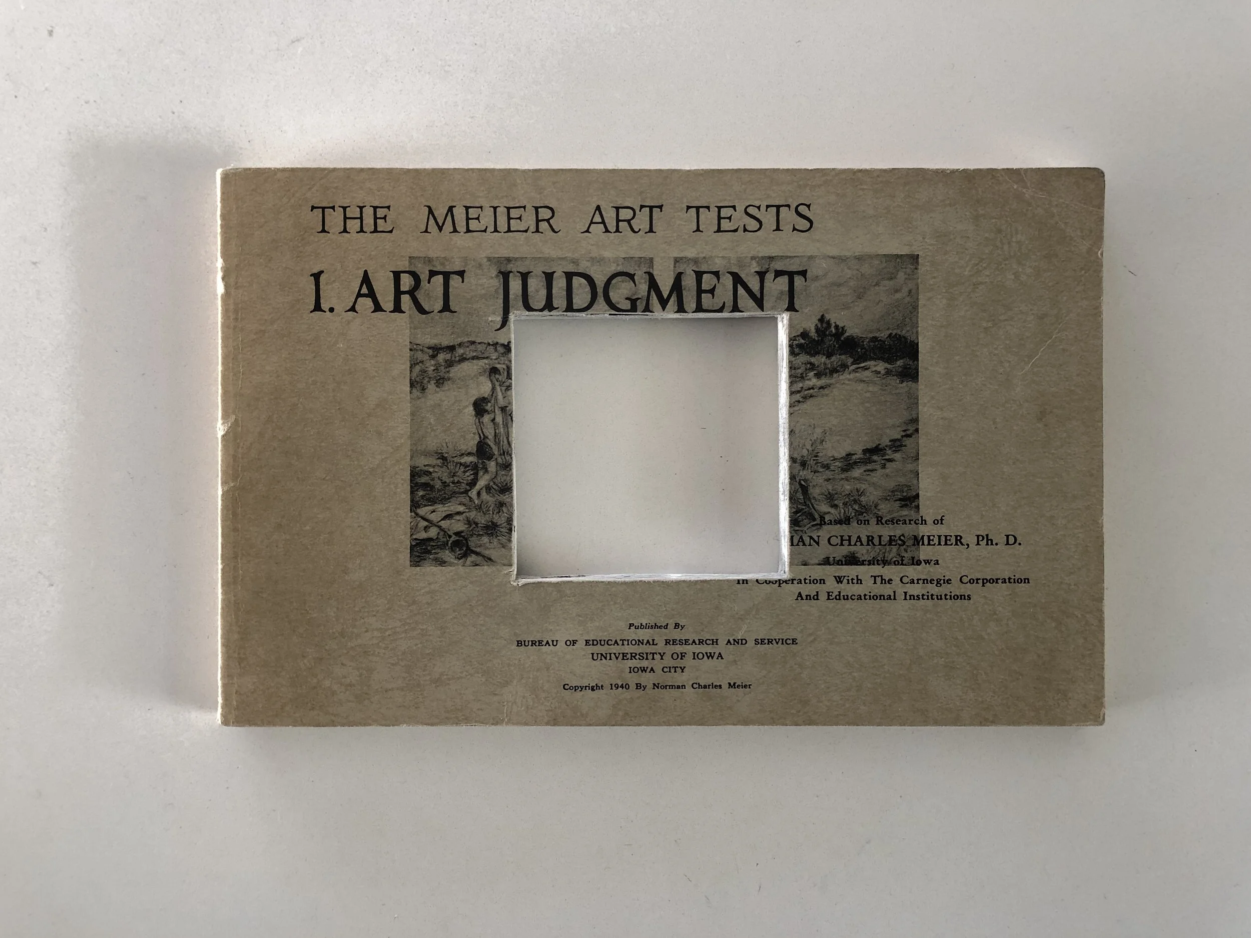 Cover of "The Meier Art Tests 1. Art Judgment" with a small square cutout in the center, published by Bureau of Educational Research and Service, University of Iowa.