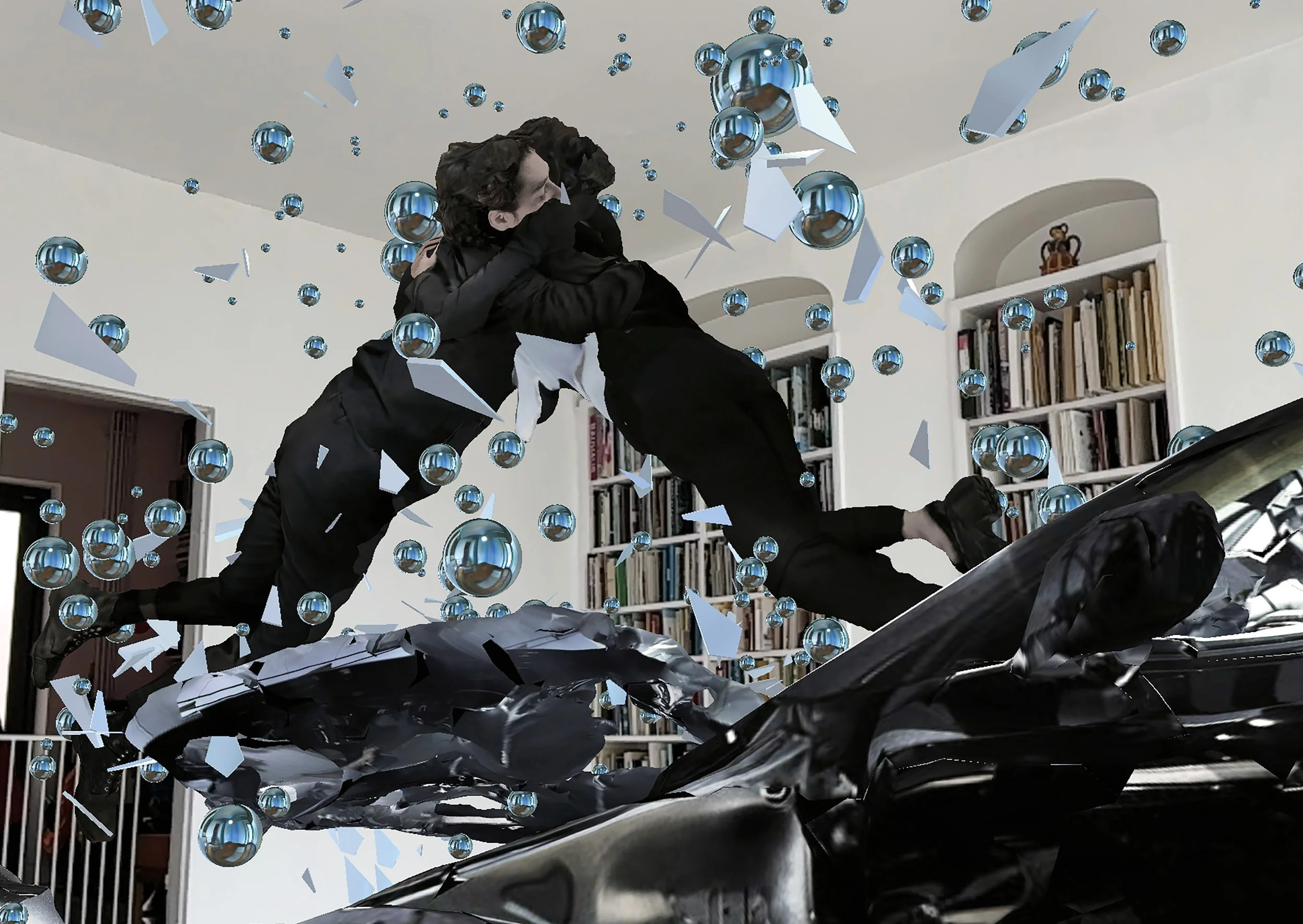 Two people in black suits floating in a room with bookshelves, surrounded by digital effects of blue spheres and geometric shards.