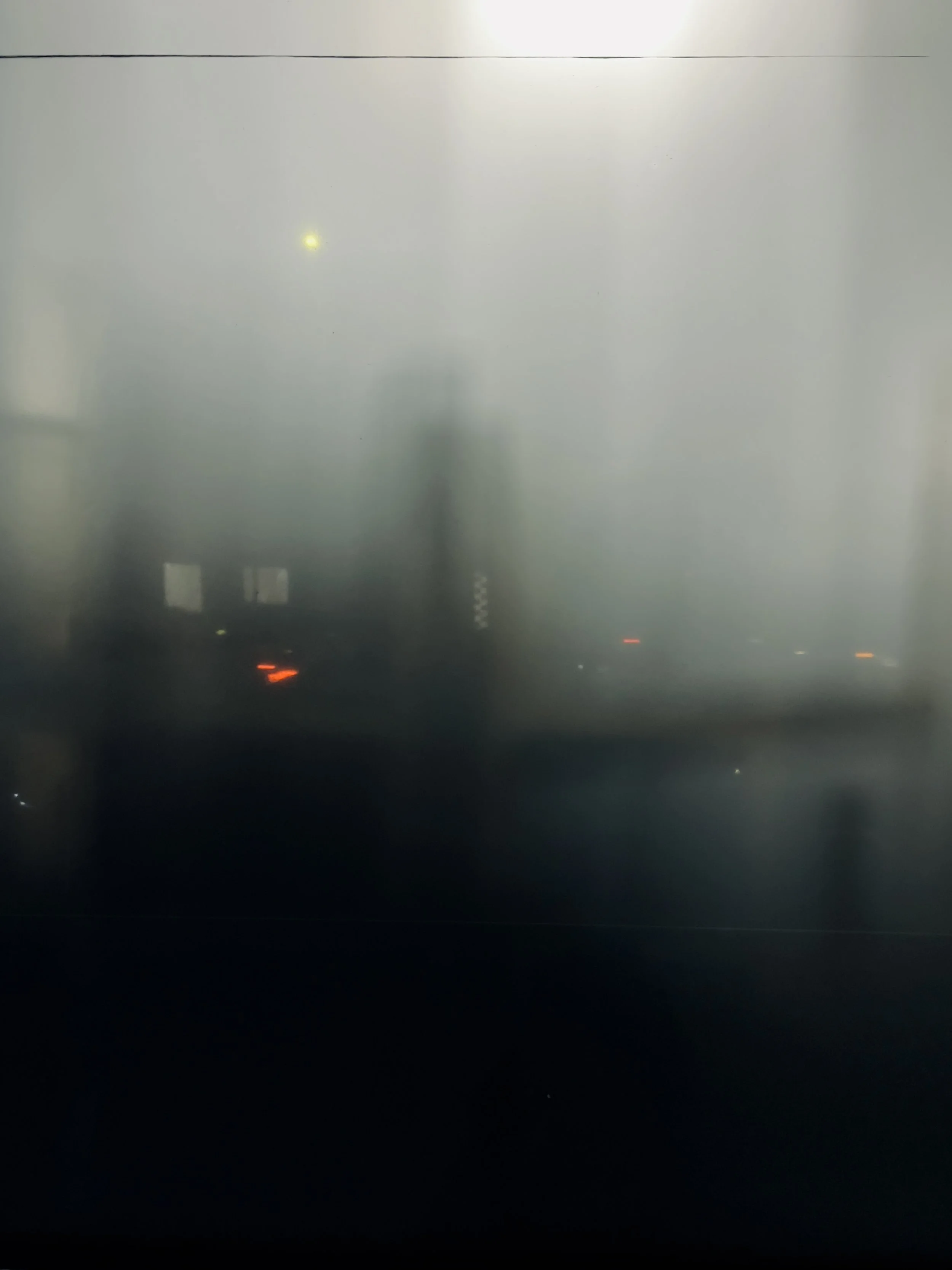 Foggy urban scene with blurred lights