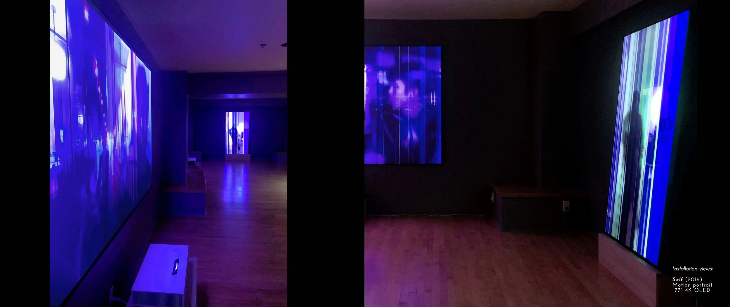 Dimly lit room with large, colorful digital screens displaying abstract motion art on walls, wooden floor, and minimal decor.
