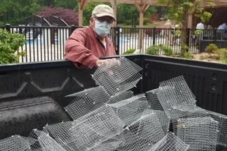 Lowell Myer Adds to cages.JPG