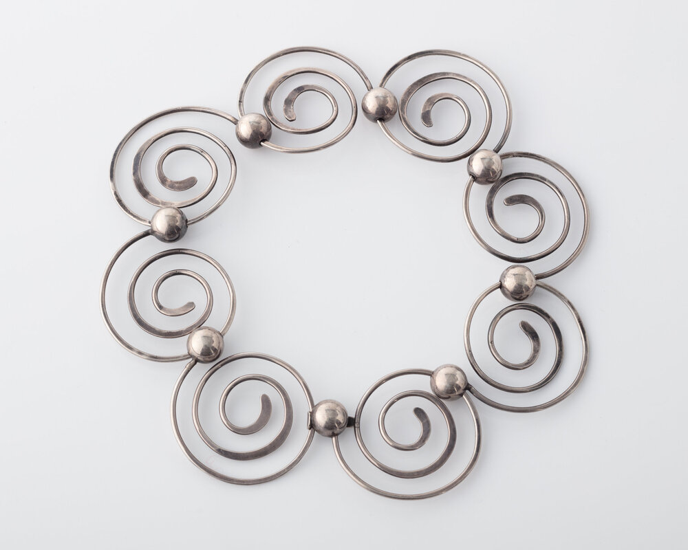   Spirals  necklace in sterling silver. Designed and made by Art Smith, USA, 1946-82. Photograph by Joe Kramm. 
