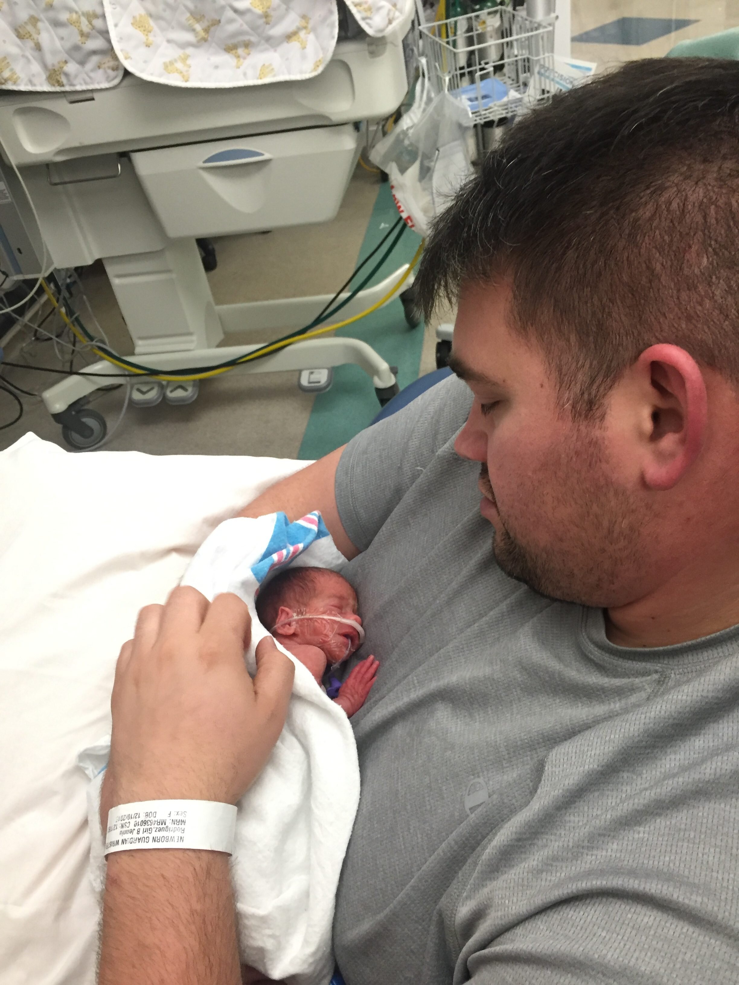 Brandon’s first time holding Lola.