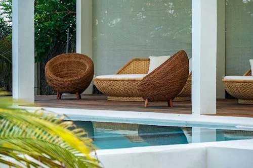Infinity Surf Resorts Hacienda Mojon in Playa el Mojon | Poolside Deck with Large Daybeds & Shaded Seating