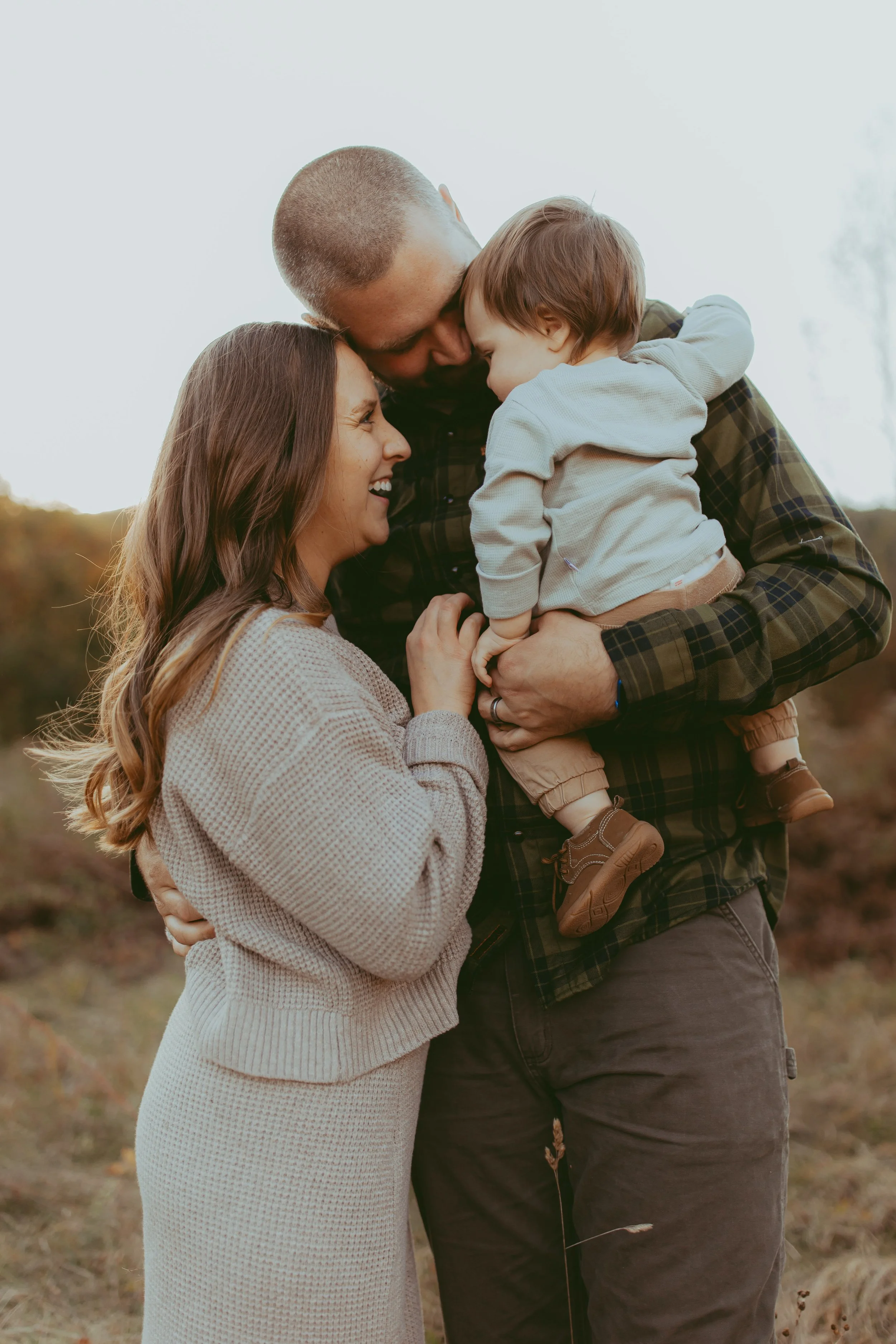 Vermont young family with baby getting family photos in vermont