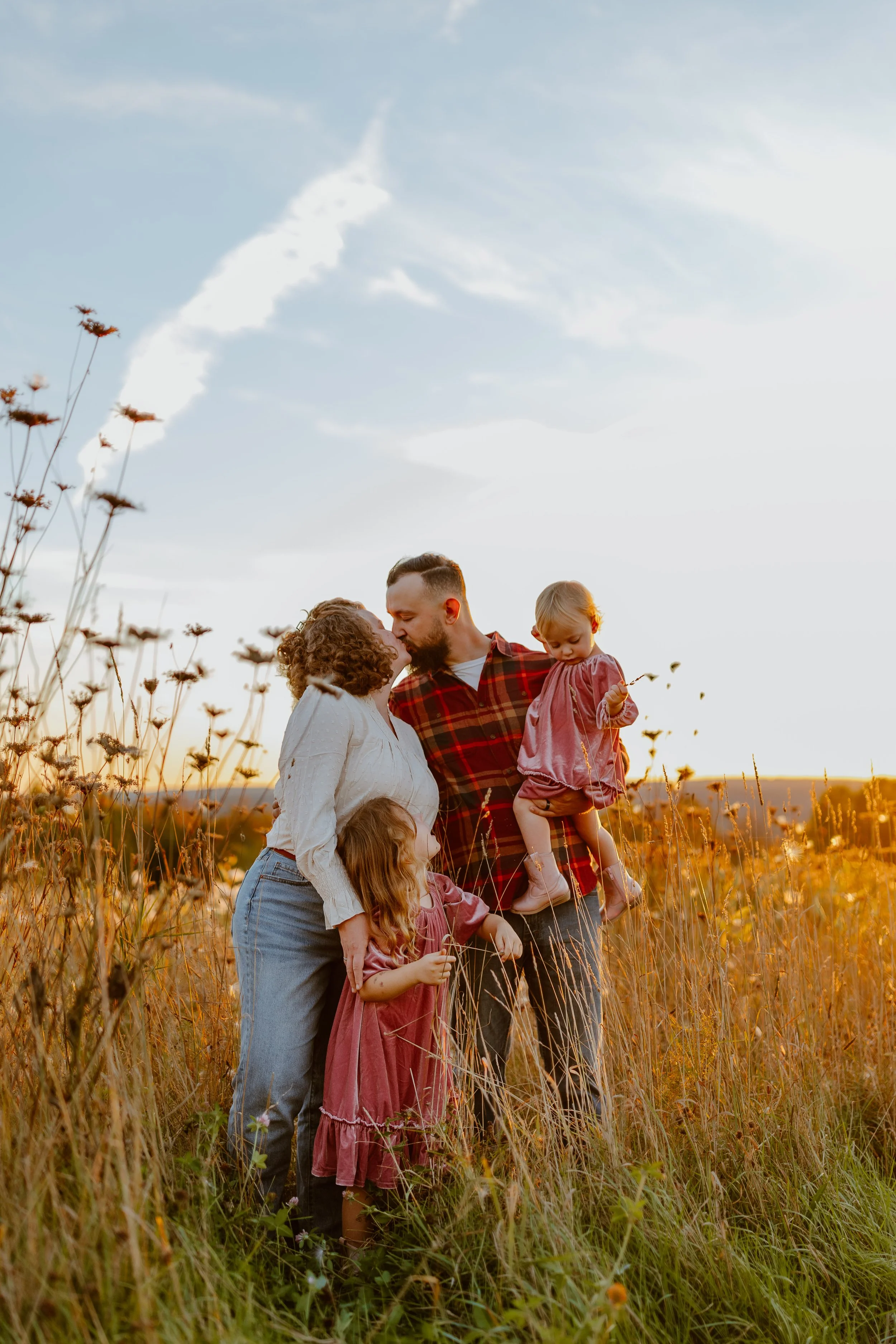 Vermont Young family photos in a field during golden hour