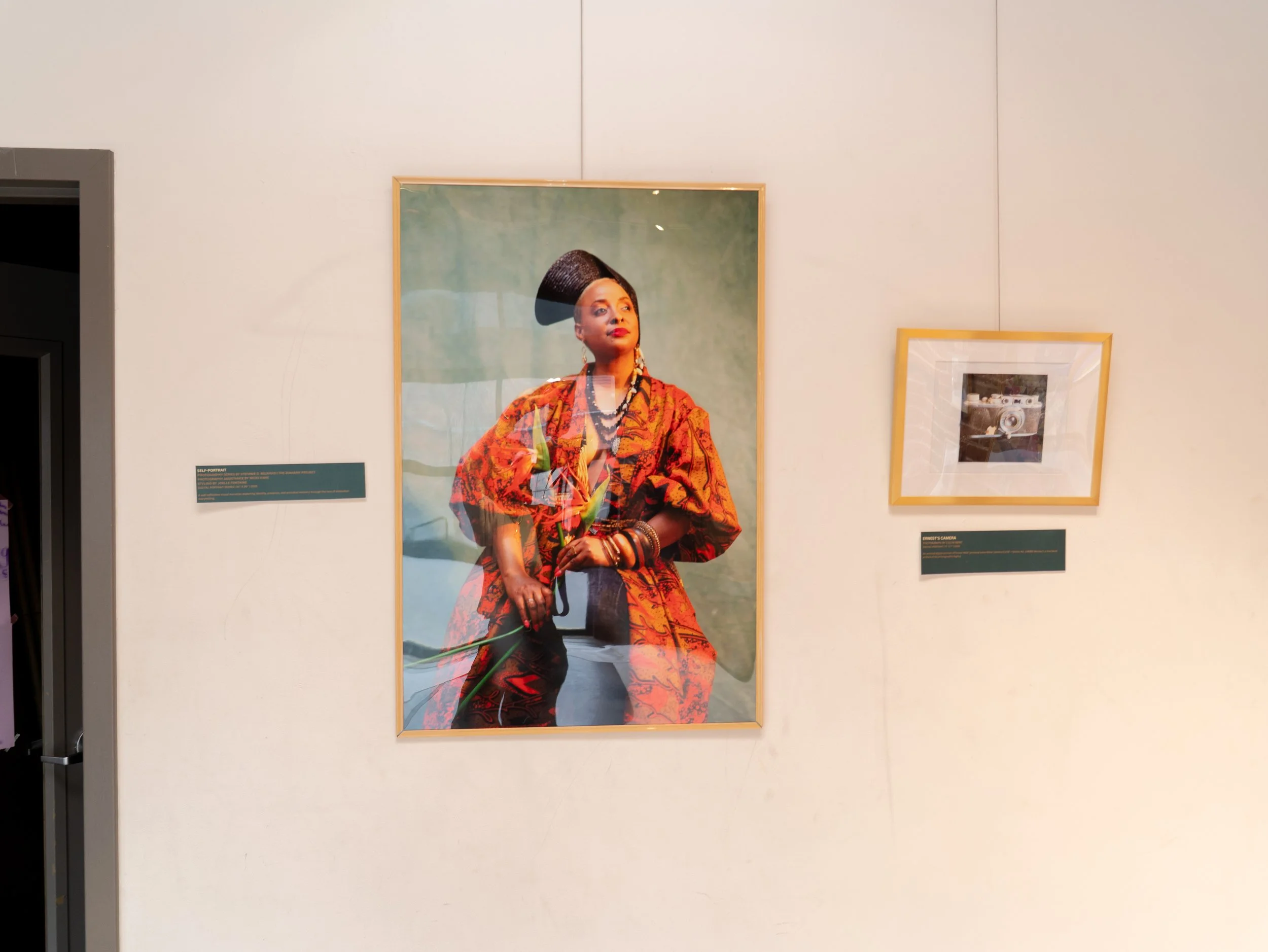 Portraits by Steffie Belnavis are displayed on the walls of the CEI gallery
