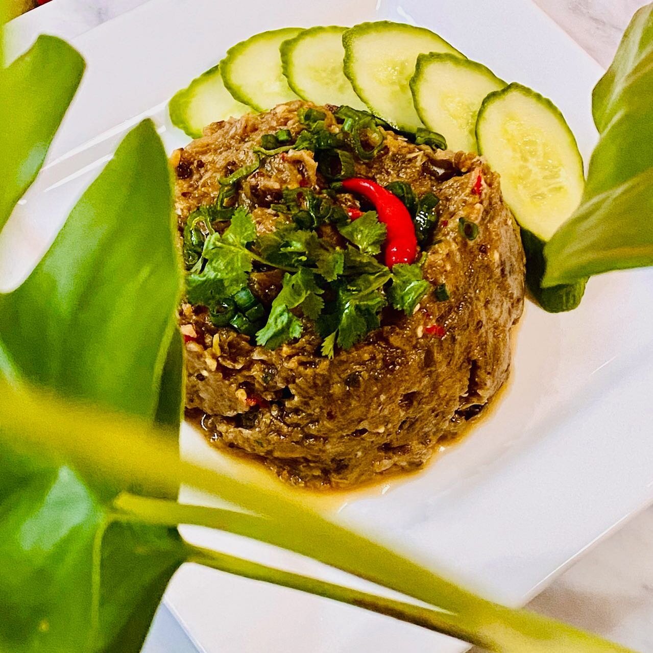 #jeow is the 🇱🇦 Lao word for sauce or dip. 

If you have a mortar and pestle you can almost turn anything into a Jeow and then have warm sticky rice to smush into it.

Pictured is Jeow Mak Keua translated as Eggplant dip. Roasted eggplant, herbs, a