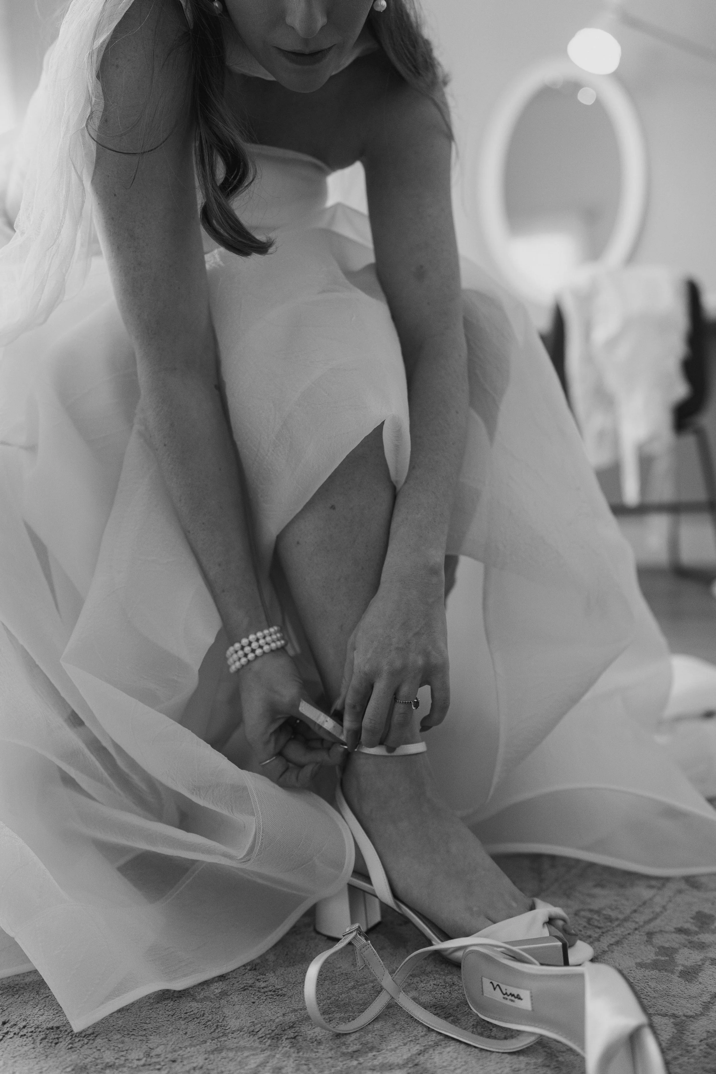 the bride putting on her shoes