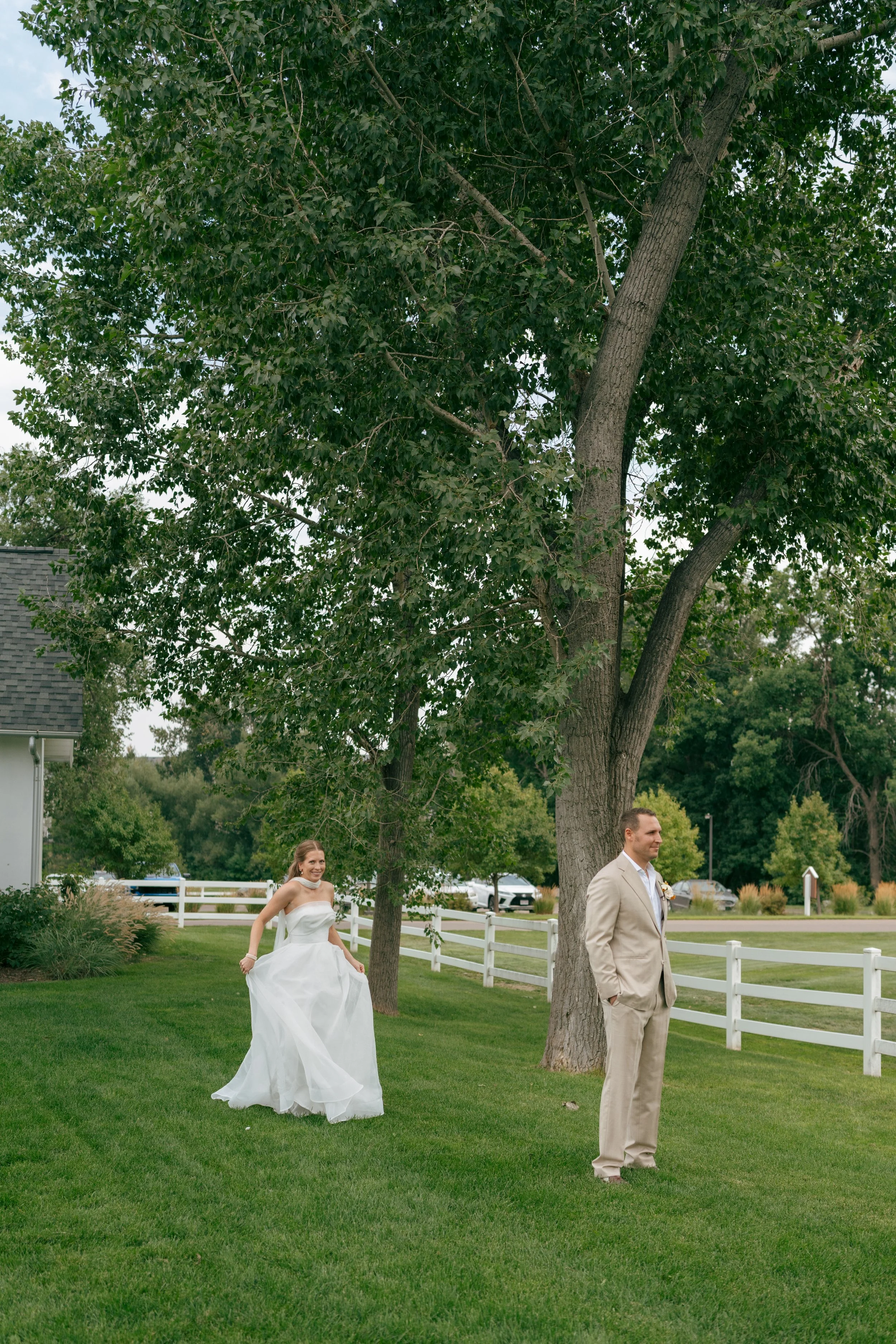bride walking up to the groom for a first look at The Barn at Raccoon Creek