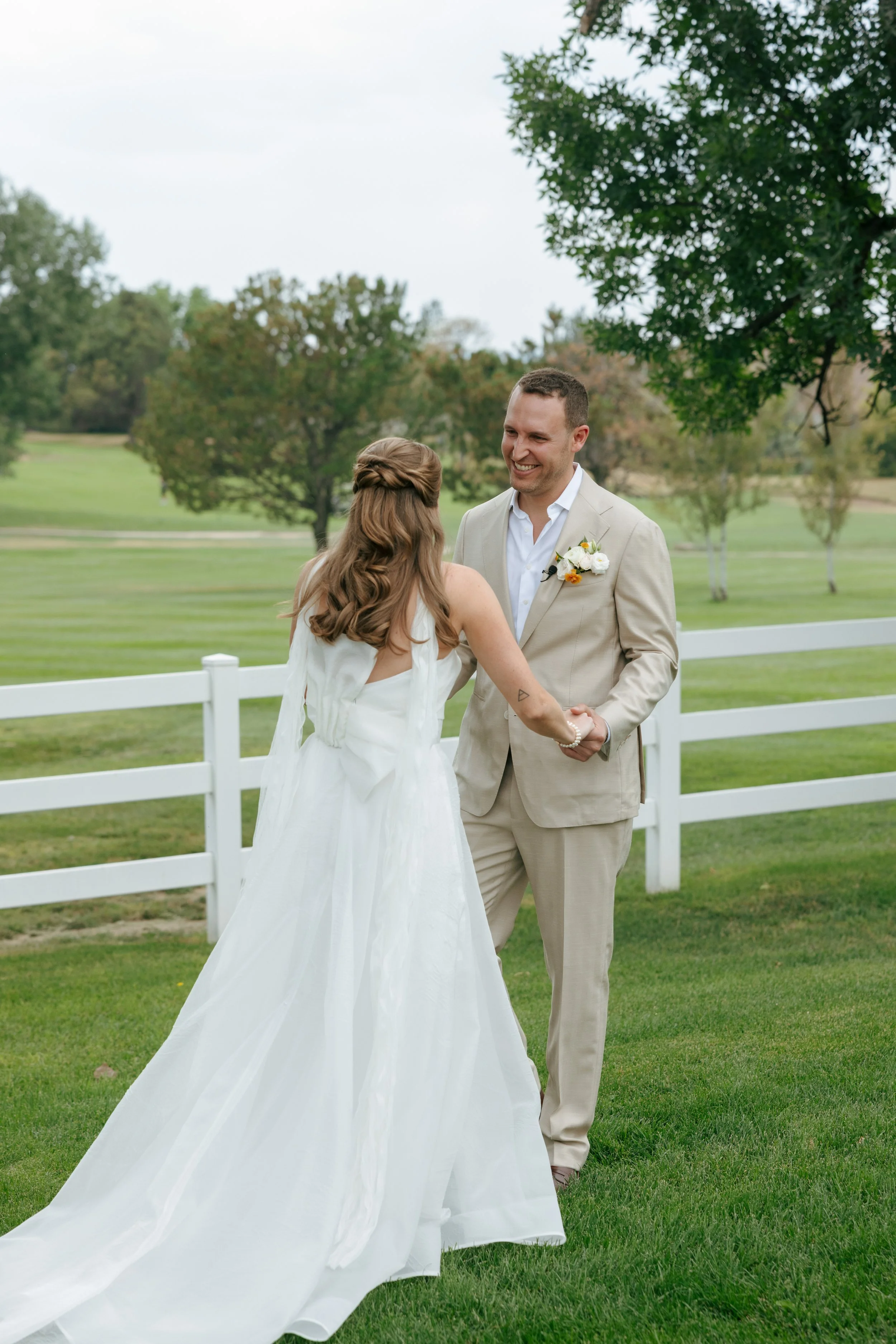 the groom's candid reaction to seeing the bride for the first time