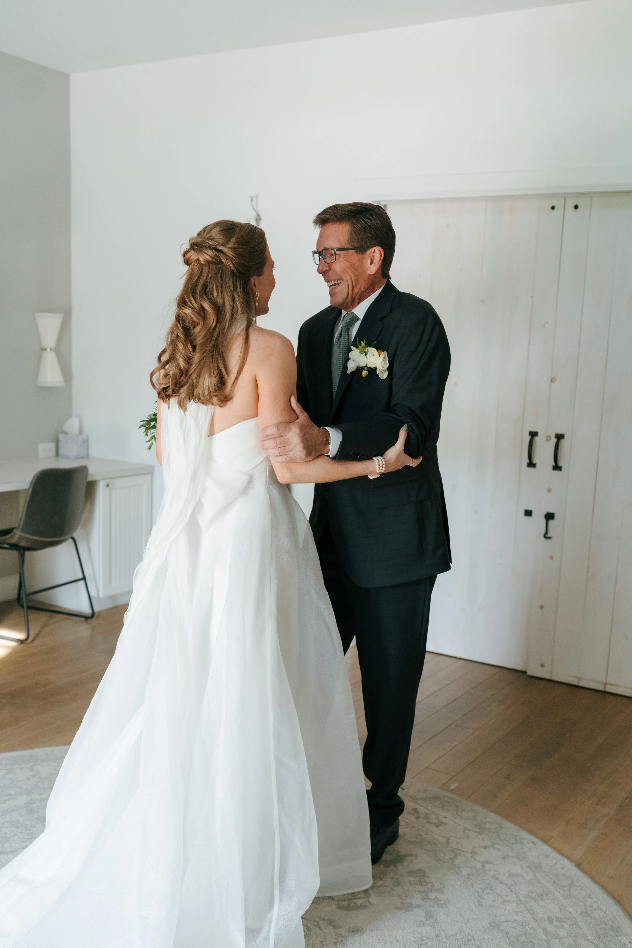 bride and dad share a emotional moment