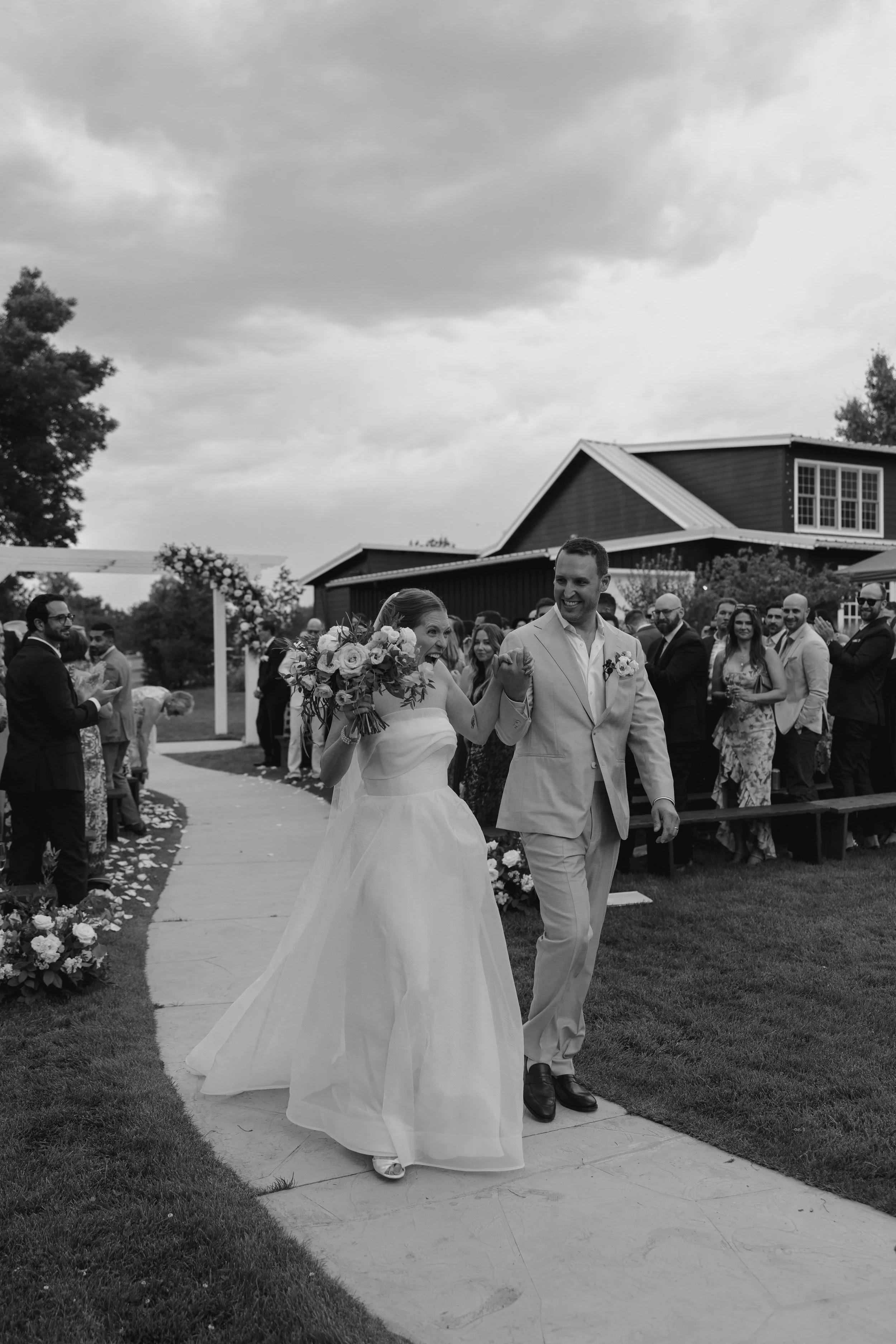bride and groom walking away after the ceremony 