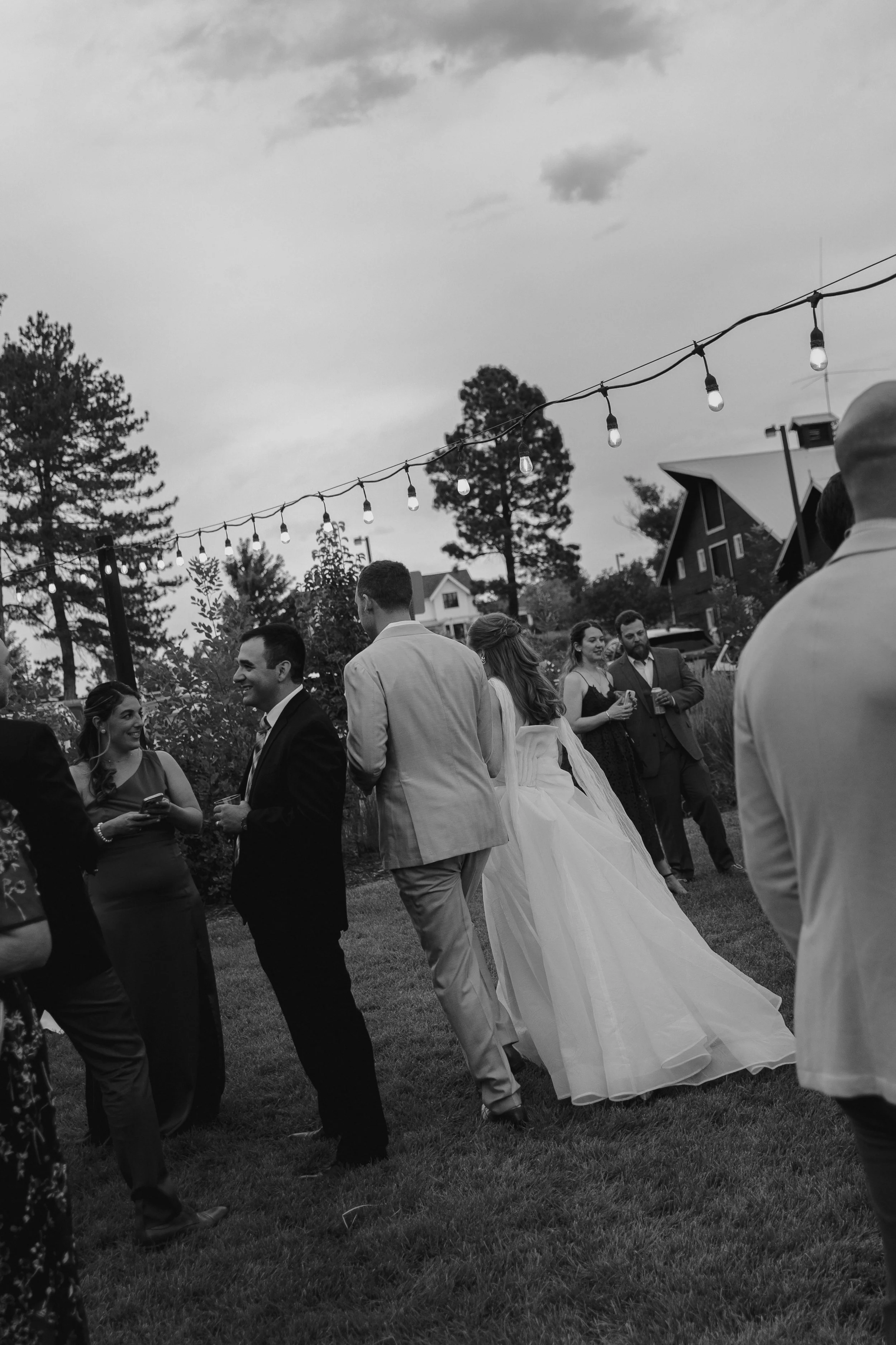 bride and groom walking into cocktail hour at The Barn at Raccoon Creek