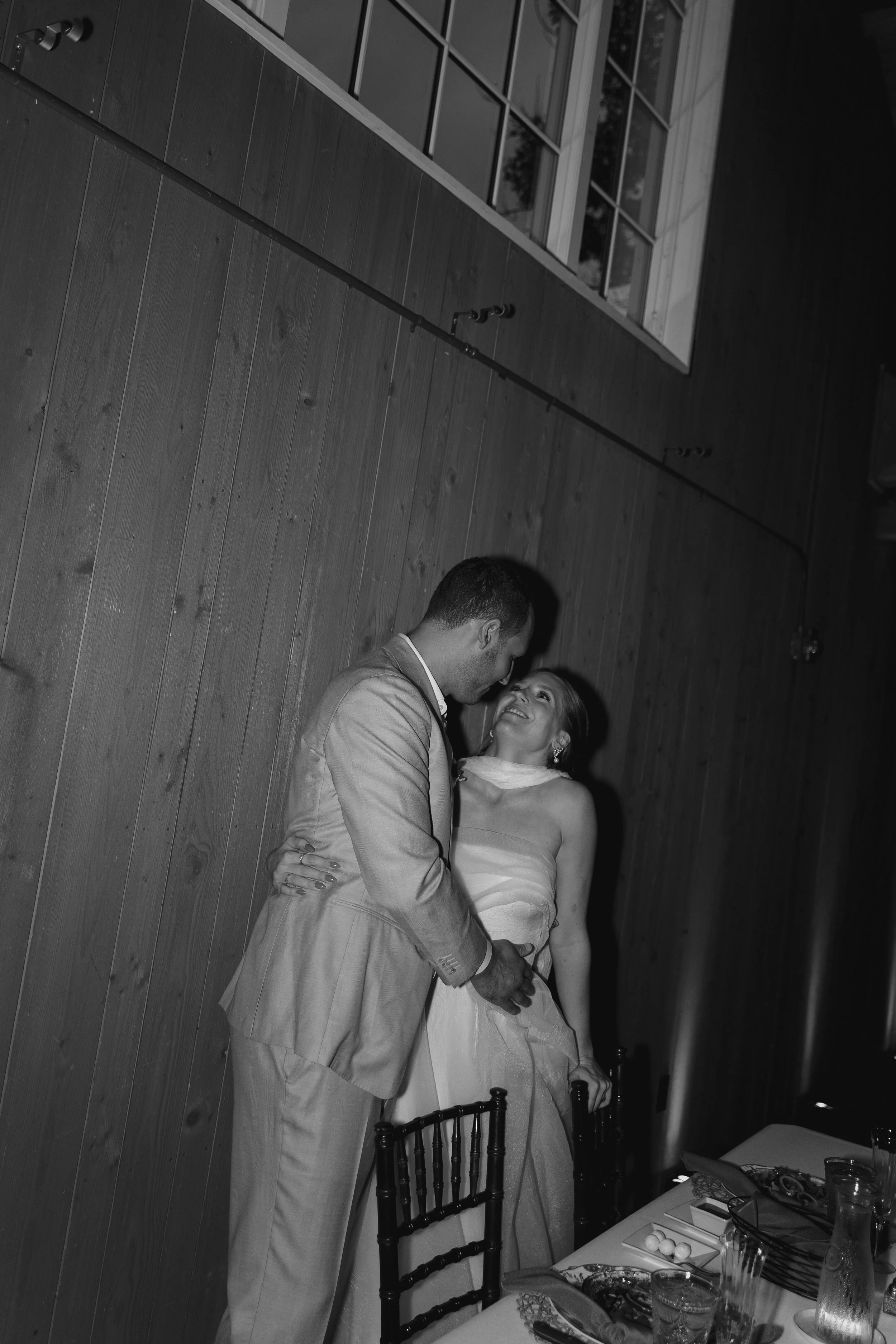 bride and groom kissing at the reception