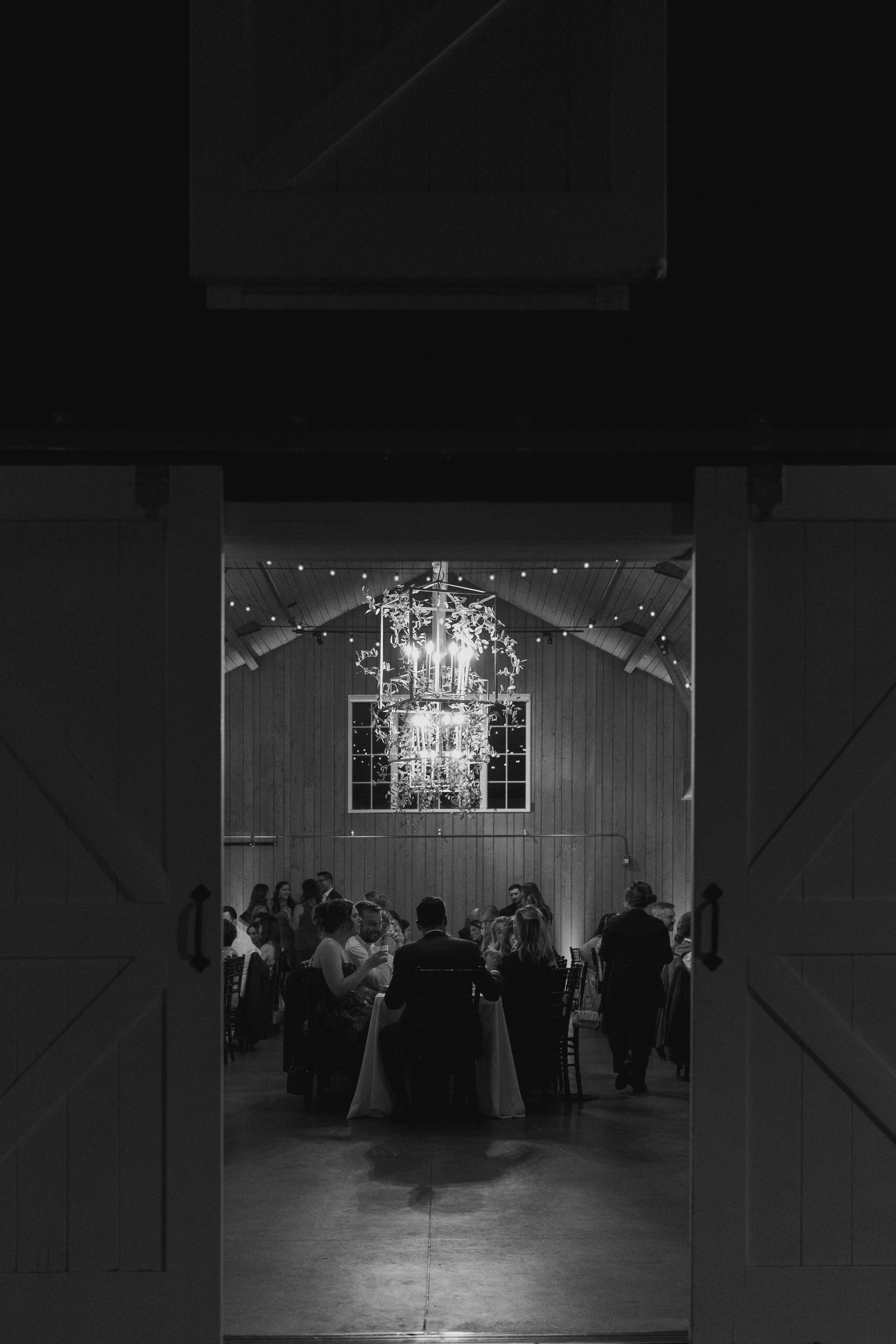 a view of the reception through the doors at The Barn at Raccoon Creek
