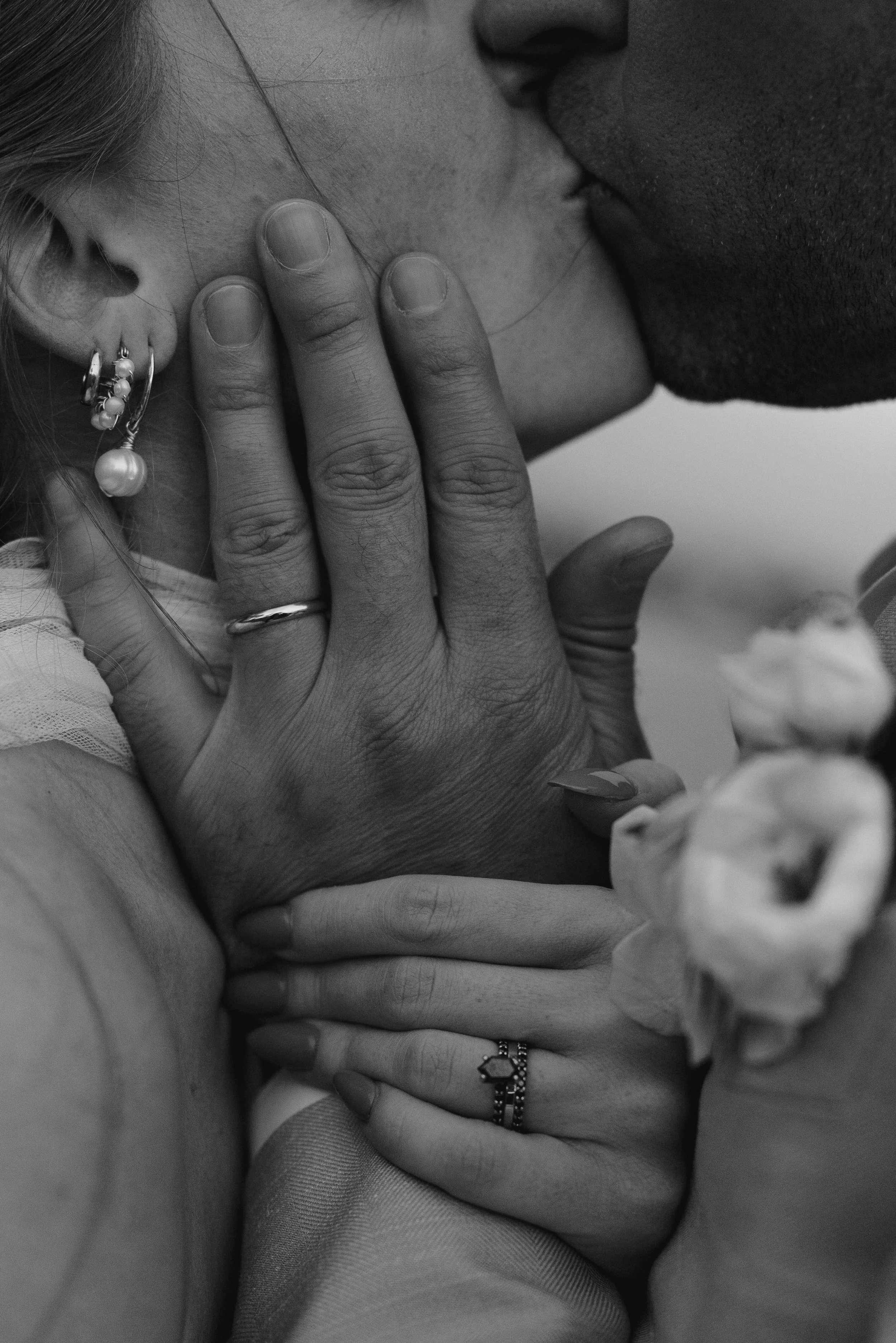 close up of the bride and groom kissing