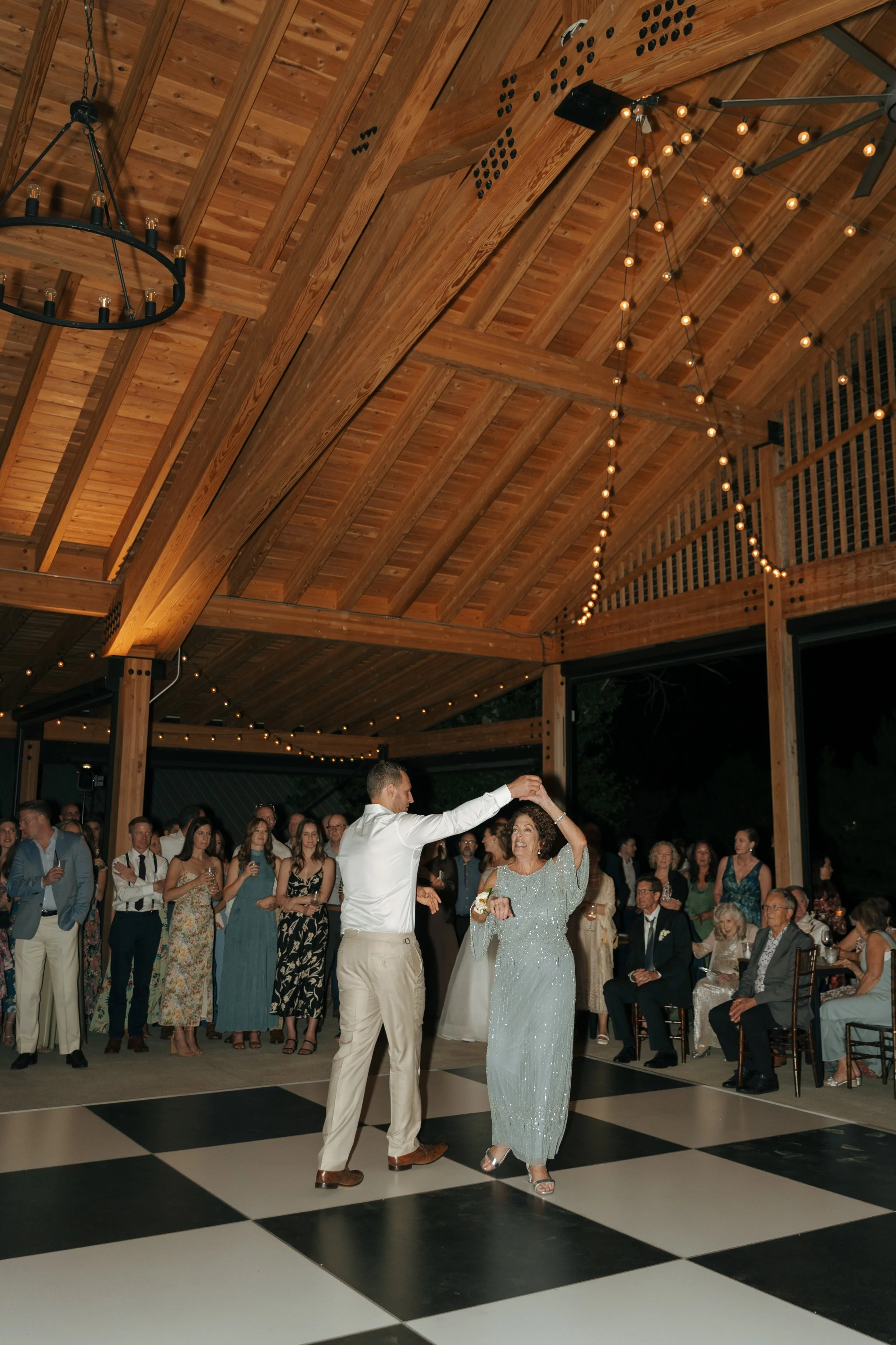 groom and his mom as they dance