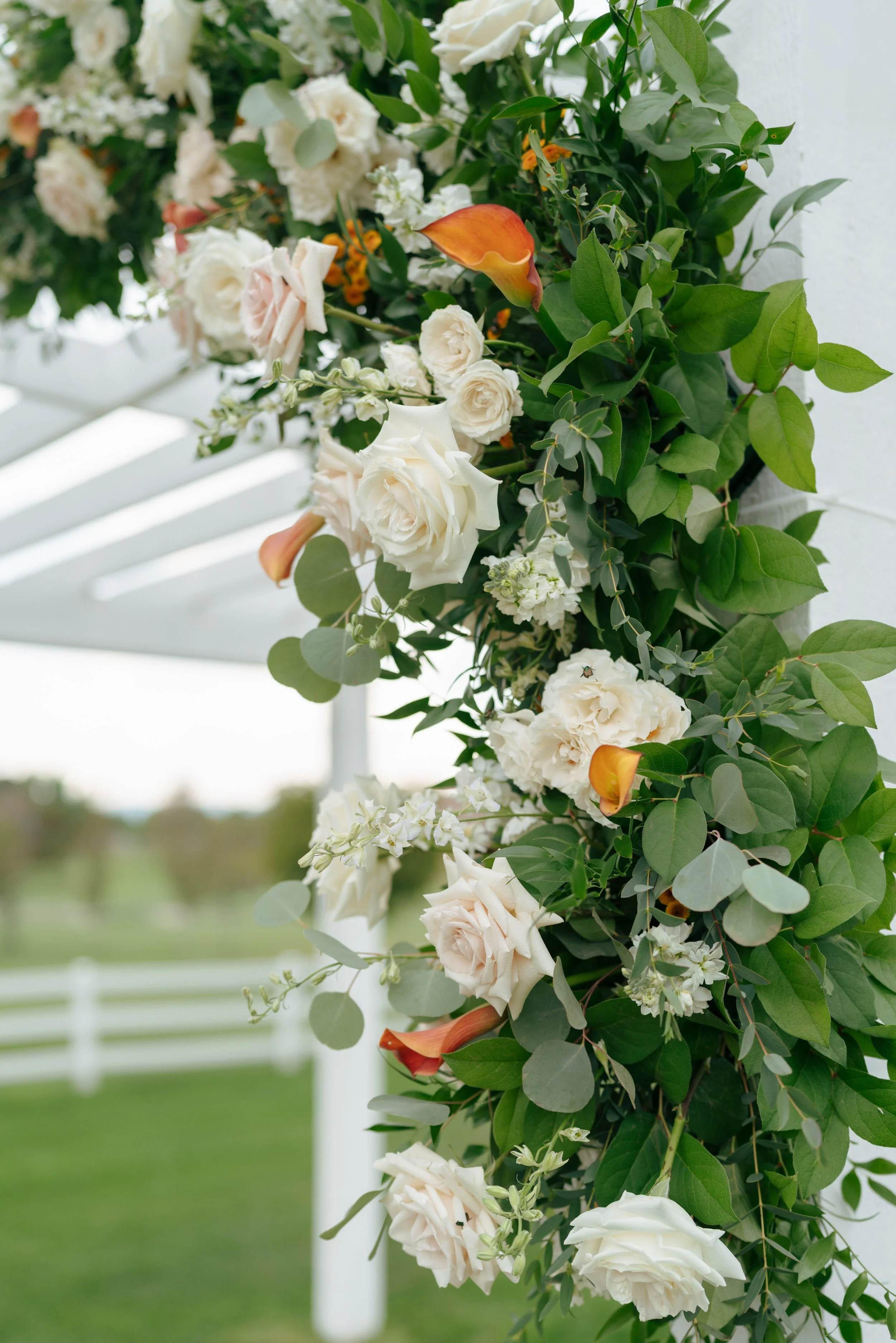 close up of floral installation on the arch 