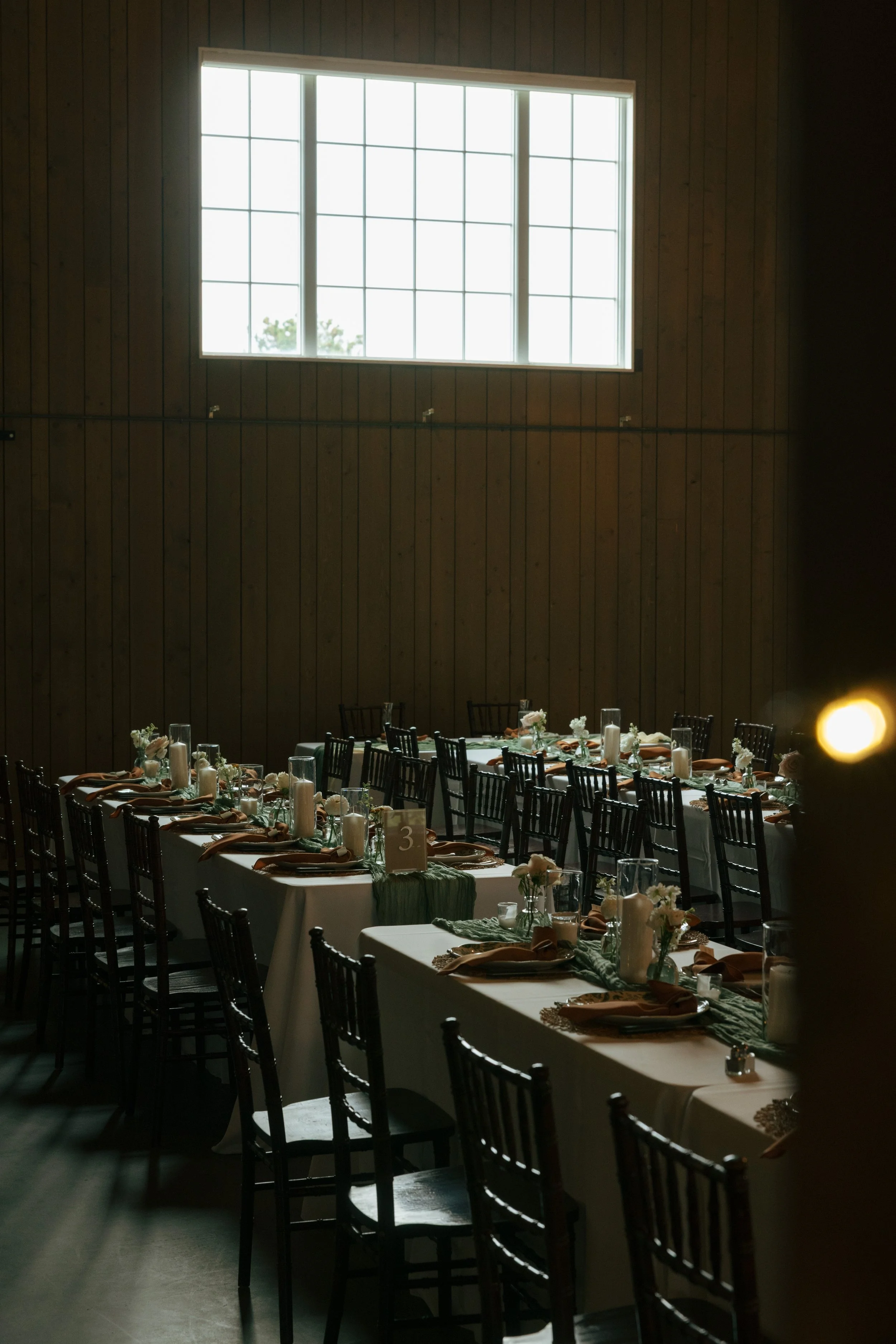 wedding reception tables in a barn