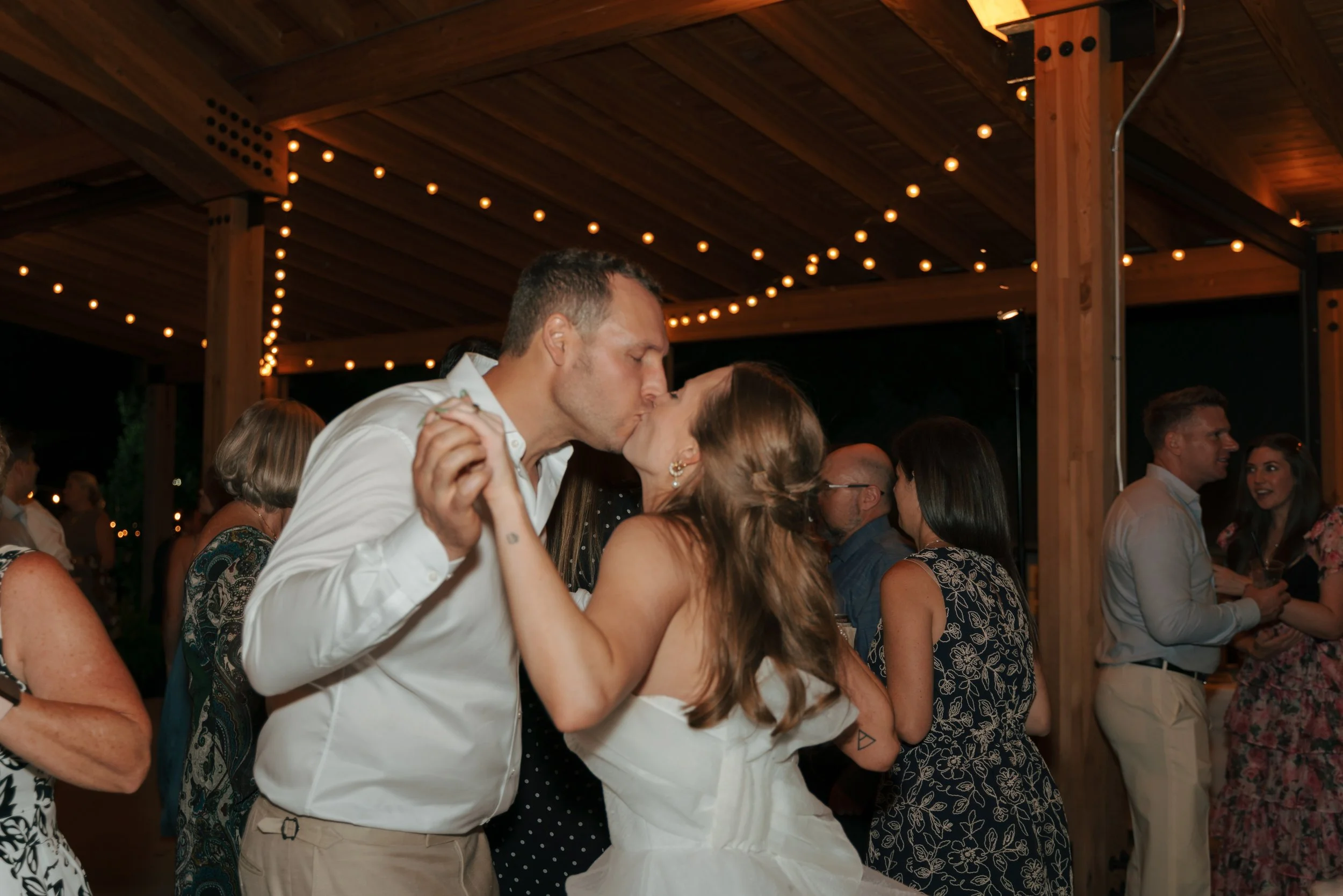 bride and groom kissing during the dance at The Barn at Raccoon Creek
