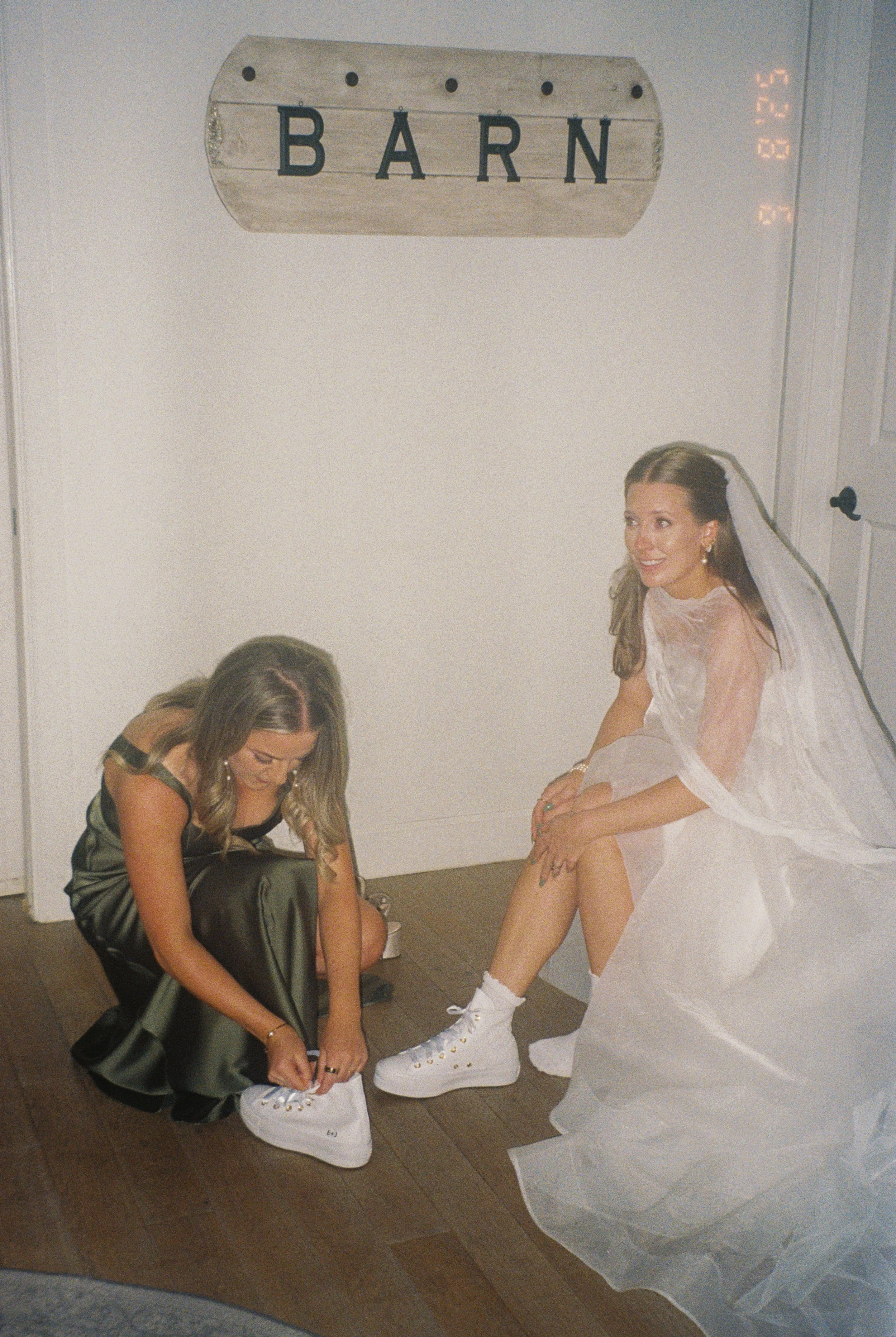 the bride changing her shoes after the ceremony