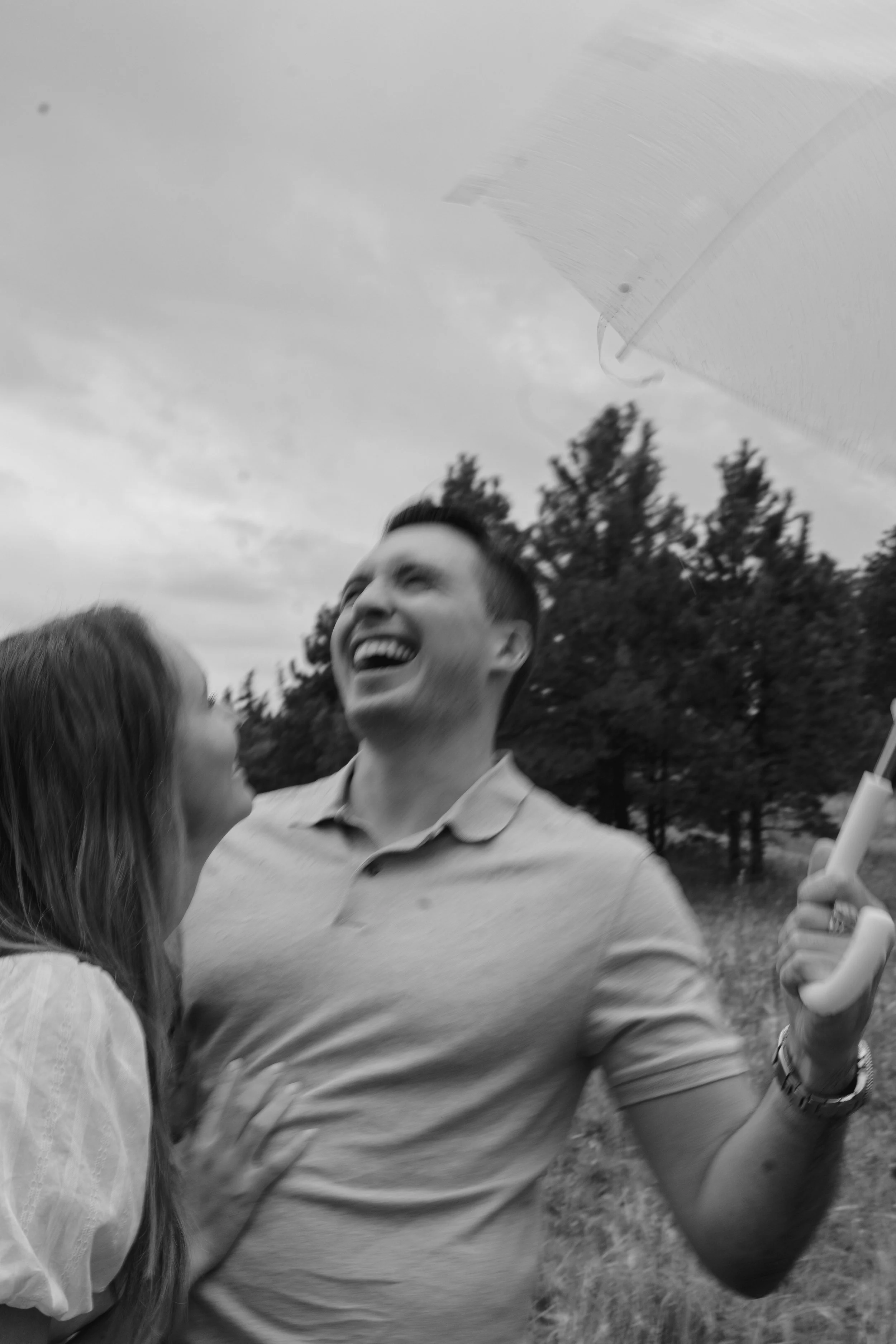 a candid cinematic engagement photoshoot in the rain