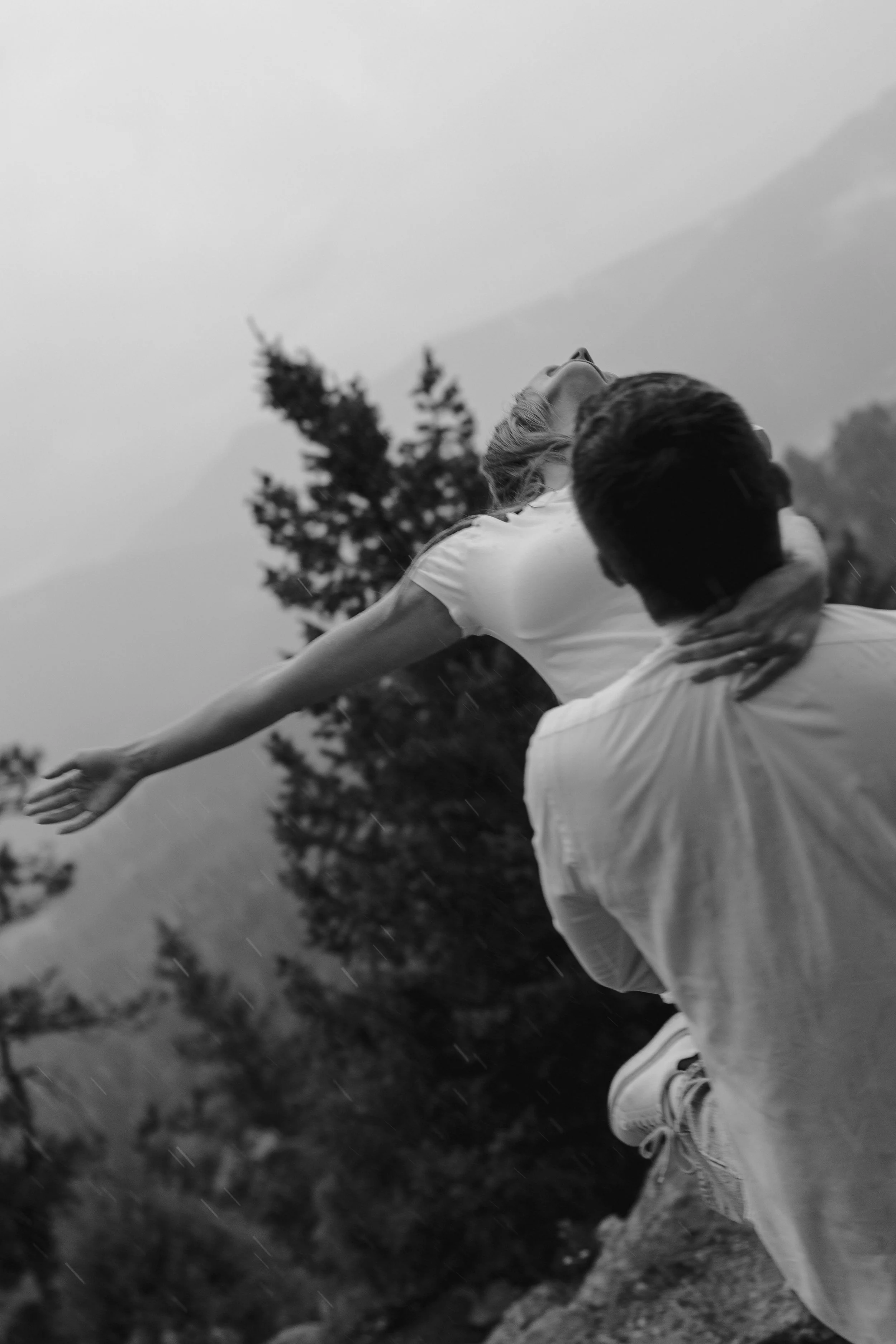 cinematic engagement photoshoot in the rain in CO