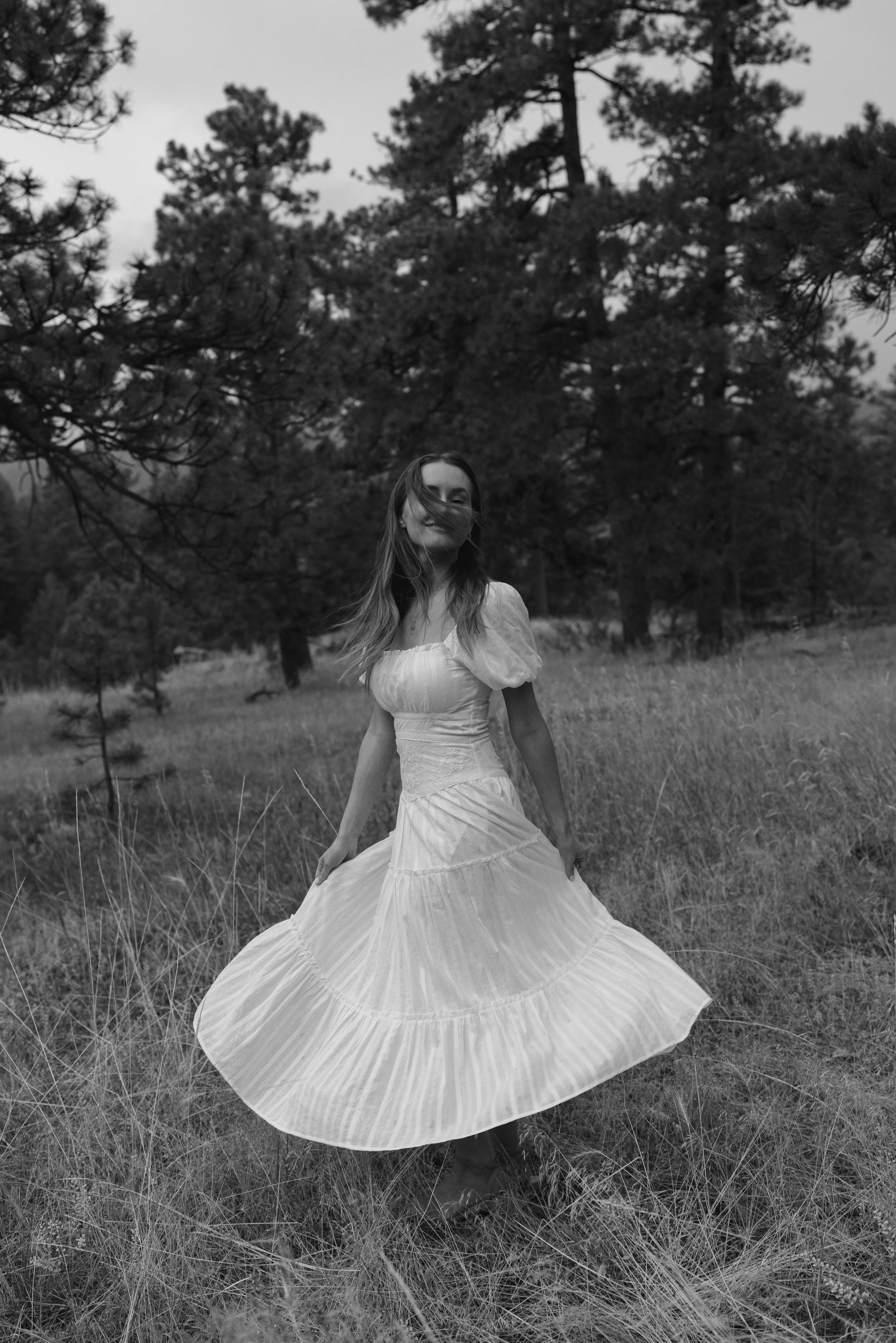 a woman dancing at her engagement photoshoot