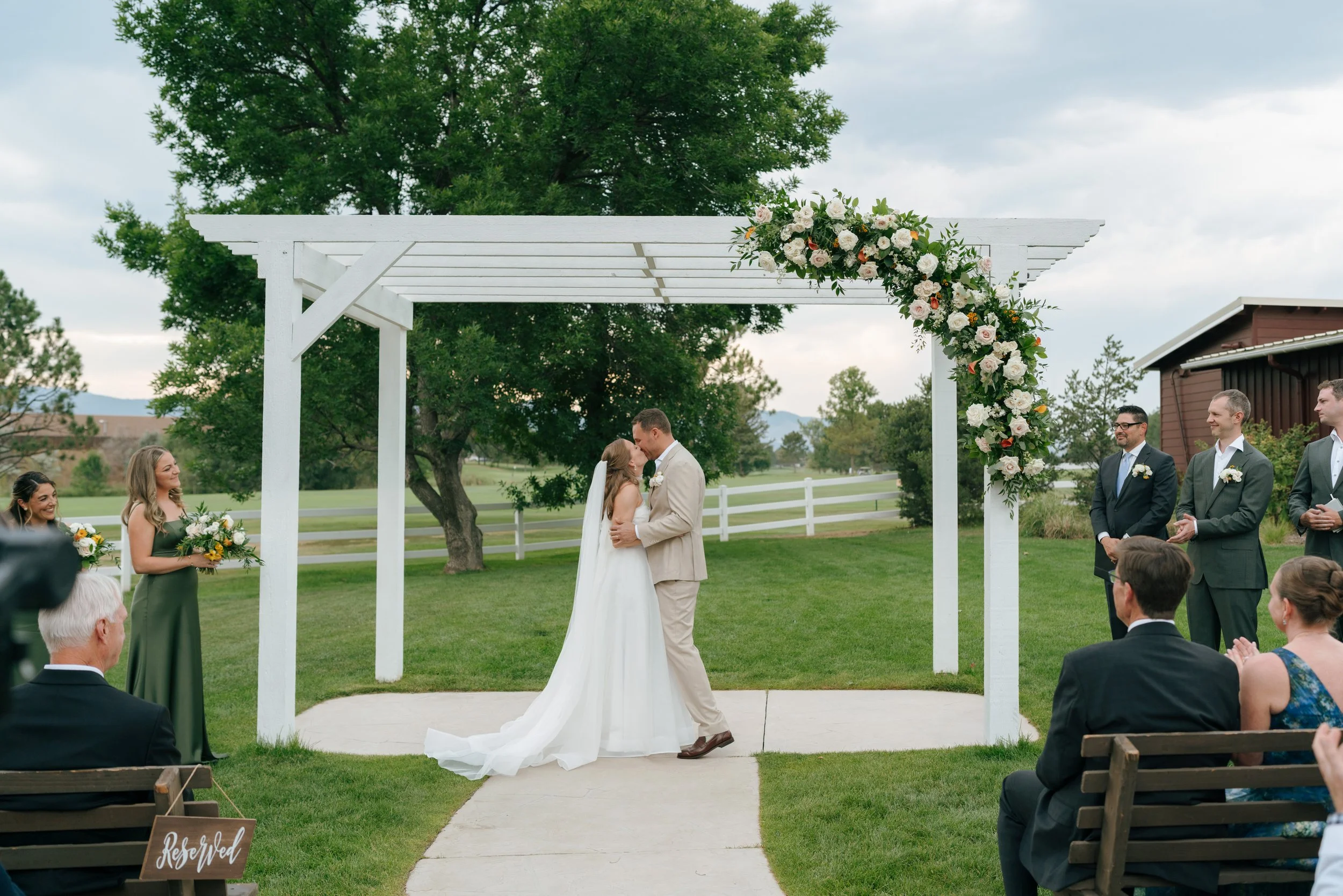 bride and groom kissing at the altar at The Barn at Raccoon Creek
