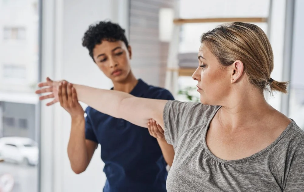 Physical therapist working on a patient's hip and lower back at Zero Point One Physical Therapy in New York, NY