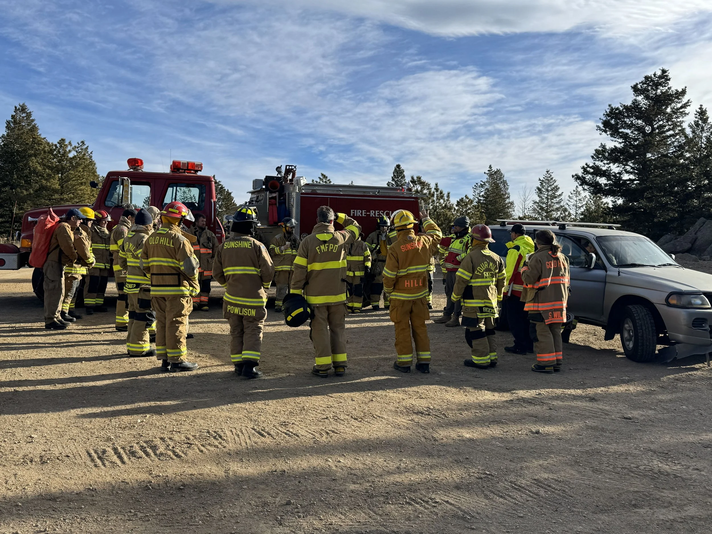 Picture shows Gold Hill, Four Mile and Sunshine firefighters at an extrication demonstration. 