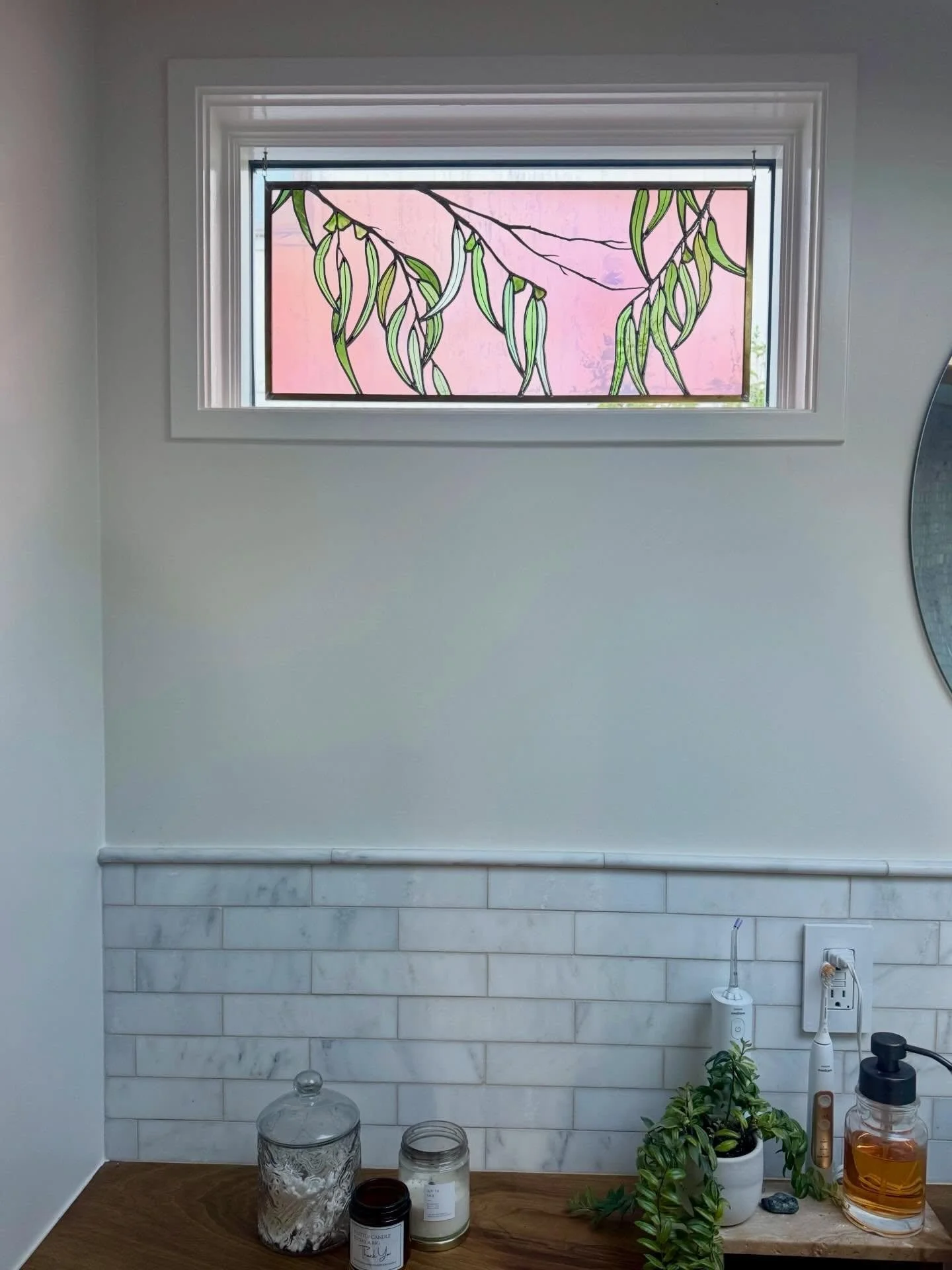 Centerpiece and privacy window for this bathroom in a Pacifca, CA home 💗 #stainedglasswindow #eucalyptus #coastalliving #gumtree