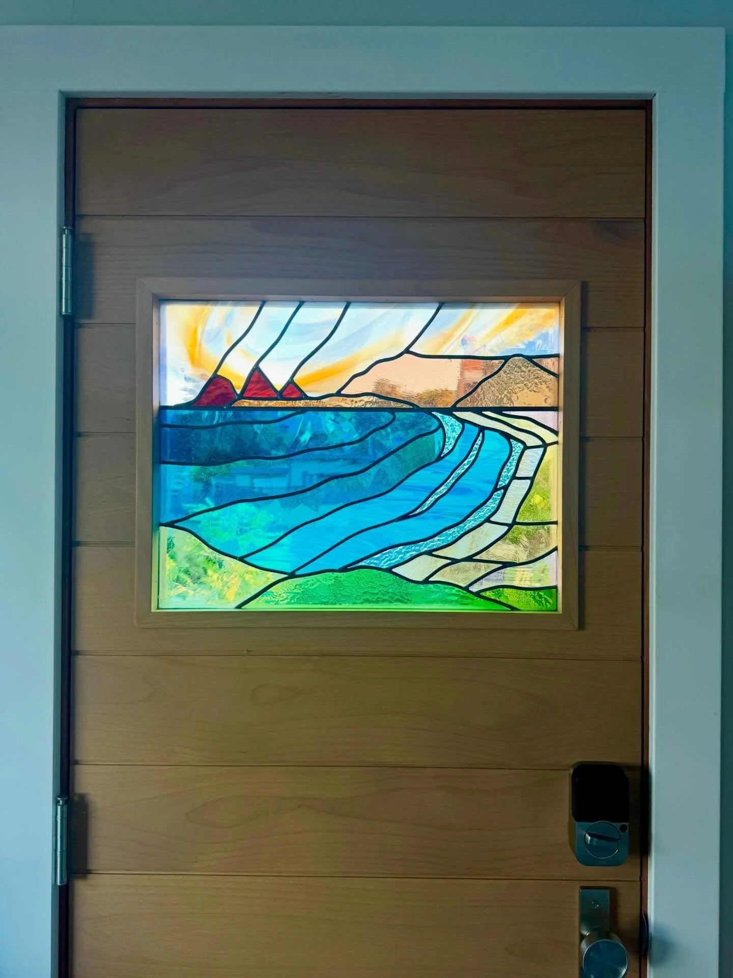 Pedro point. If it seems backwards, it&rsquo;s because when seen from outside the front door, it lines up with the real thing- as seen from this Pacifica home. #stainedglasswindow #doordesign #coastalliving #oceanart #centralcoastca