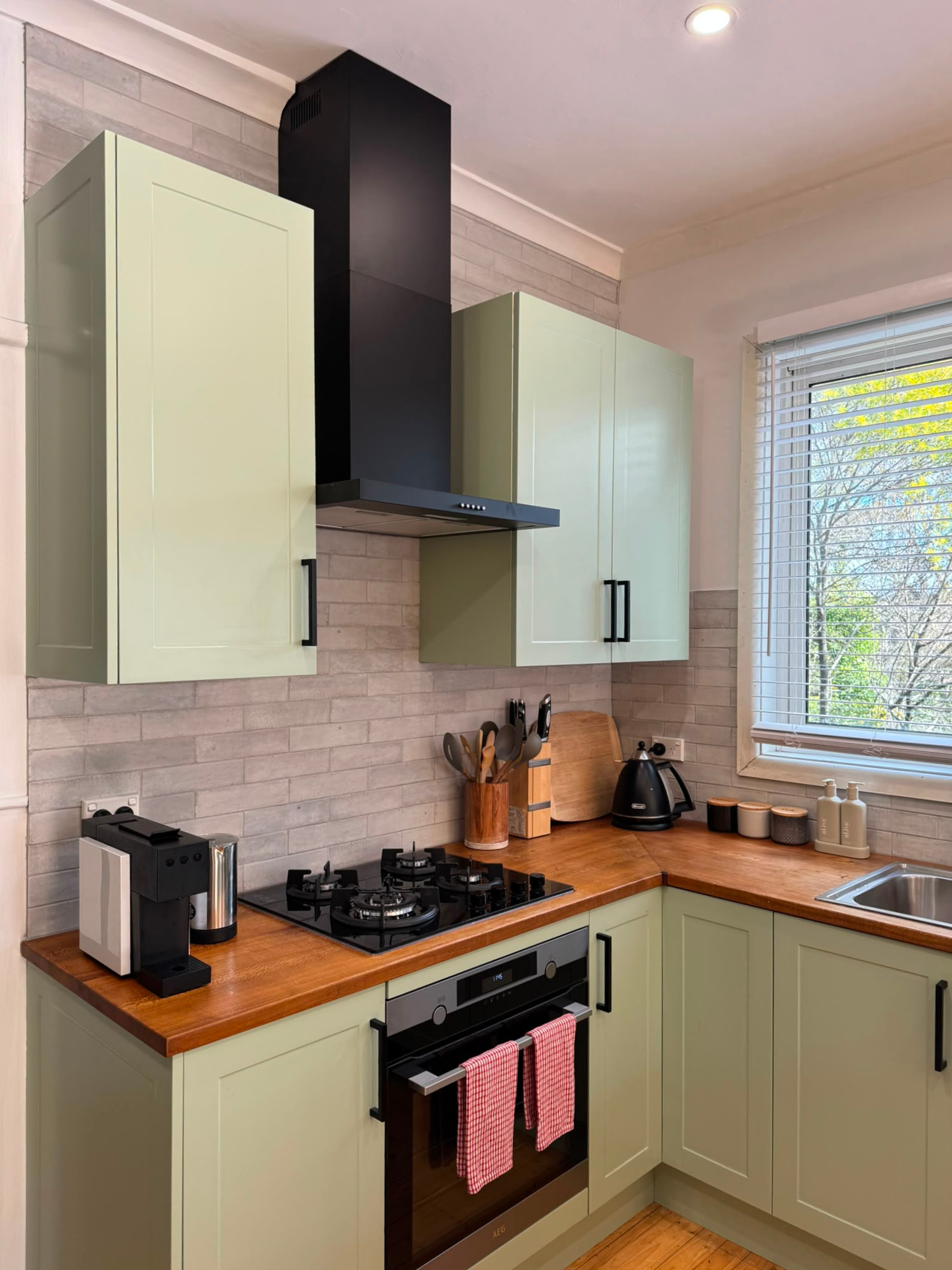 Fully equipped kitchen with gas cooktop, oven, coffee machine and cooking essentials in this Katoomba holiday house.