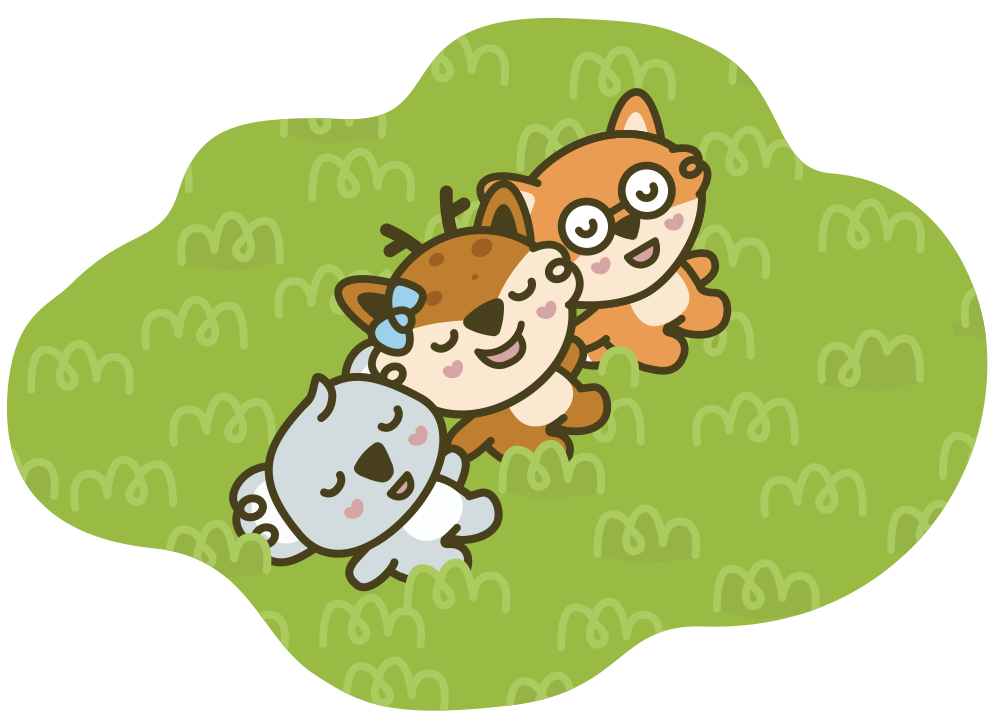 Three Queebi animals - a koala, a deer, and a fox - lying on green grass.