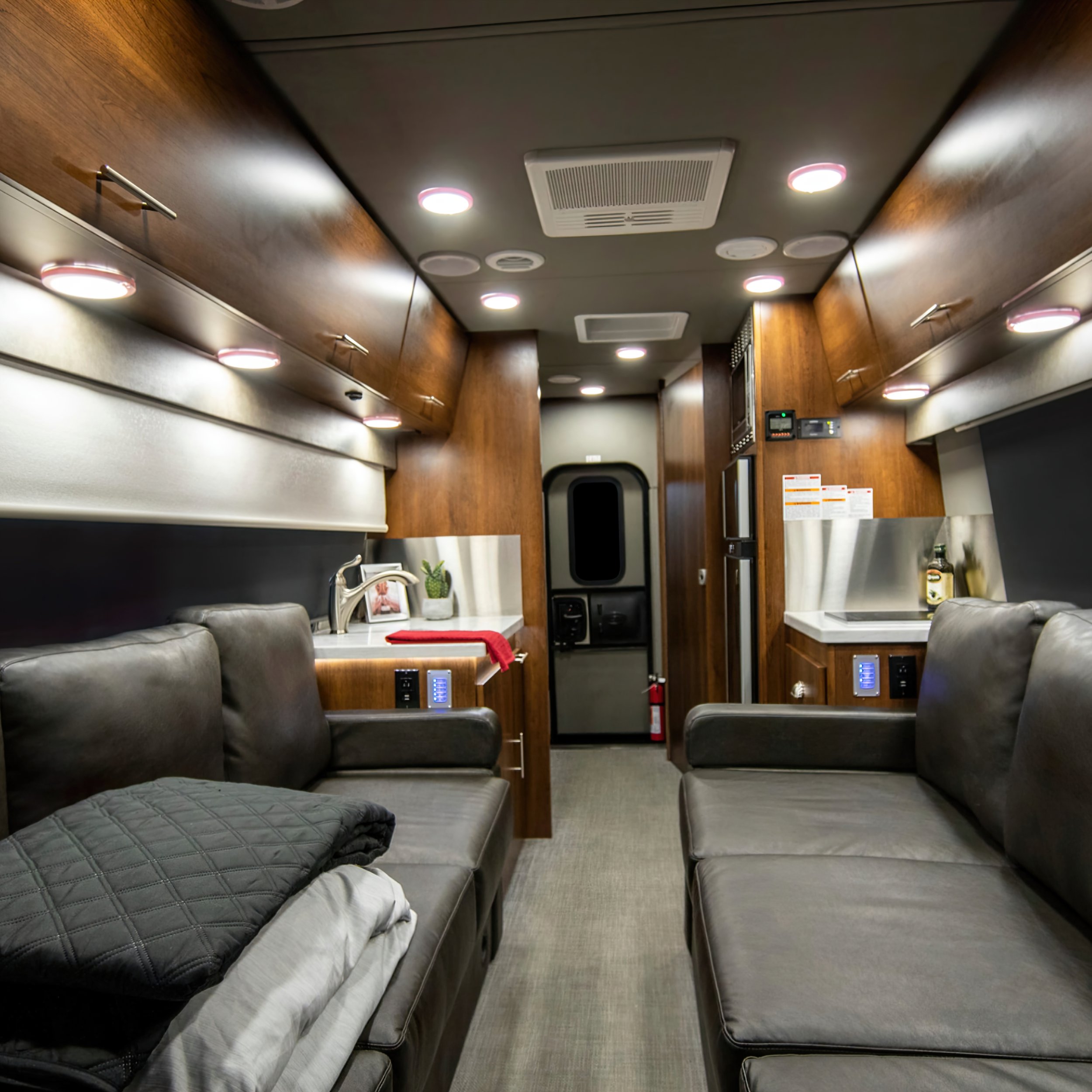  You'll notice the Summit Class C Motor Coach structure is slightly different than the others. The entrance, for instance, in the very rear opens to a closet on your left and a toilet room to your right.  Beyond that, you will see the shower and dual