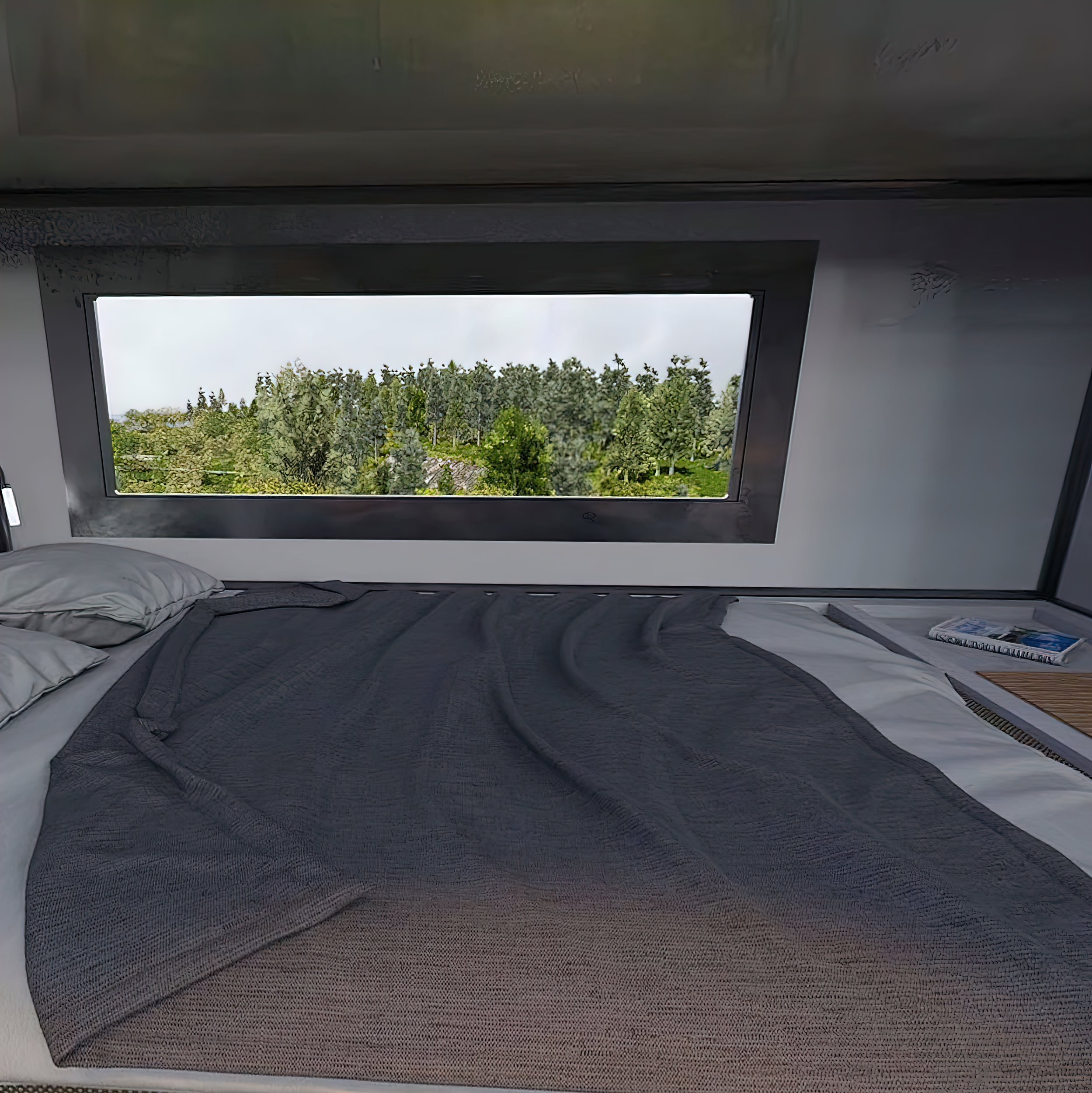  Through the process, the interior sees some changes as well. The main double bed is pulled out to the side, which conveniently frees up the multipurpose floor space to access the indoor kitchen and a few drawers and slide-outs from the bed frame. 