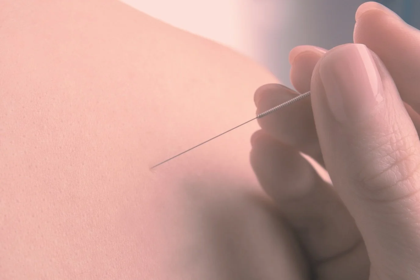A person uses a sewing needle to insert a thread into skin.