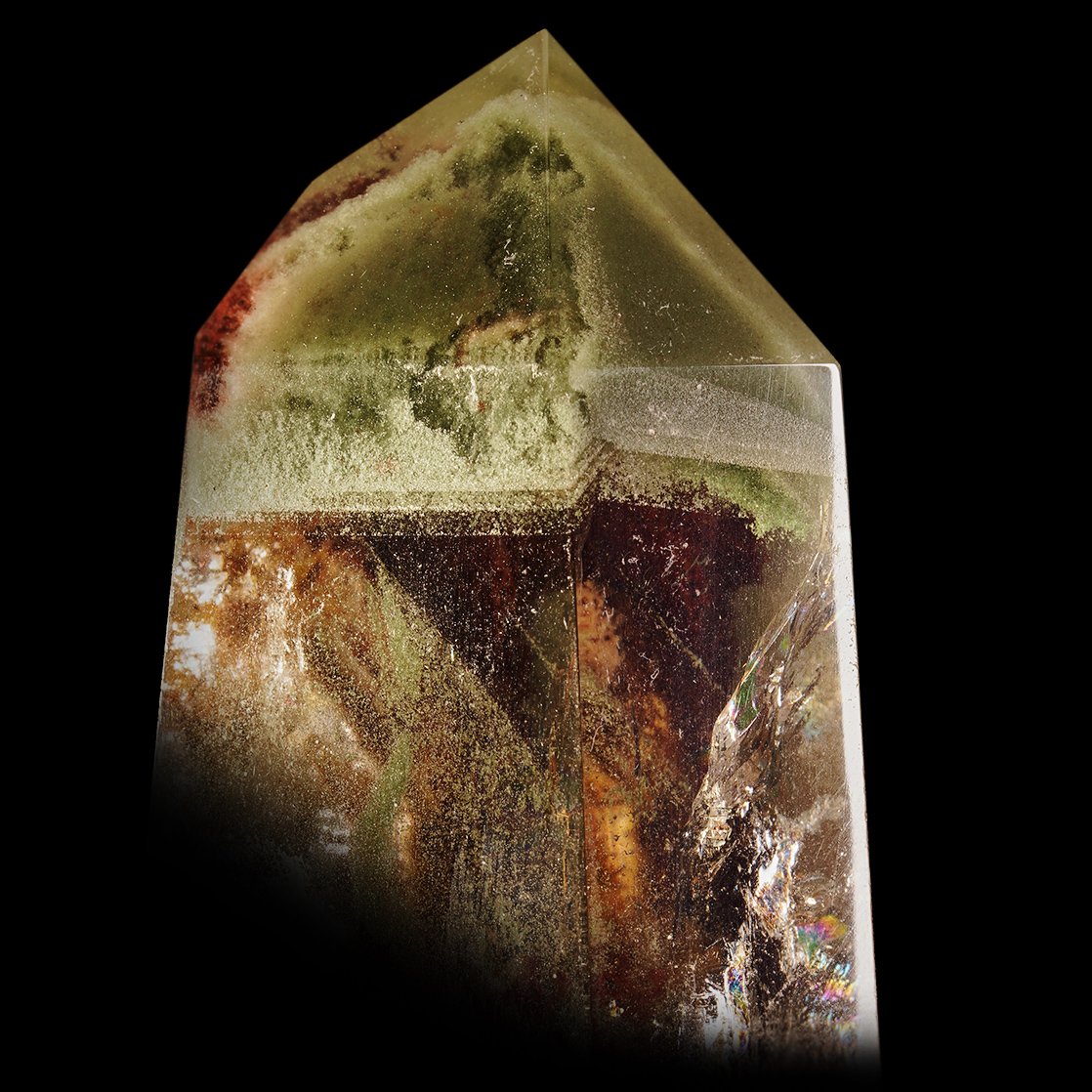 A close-up of the included green Chlorite phantom within the Lodolite Quartz Prism.