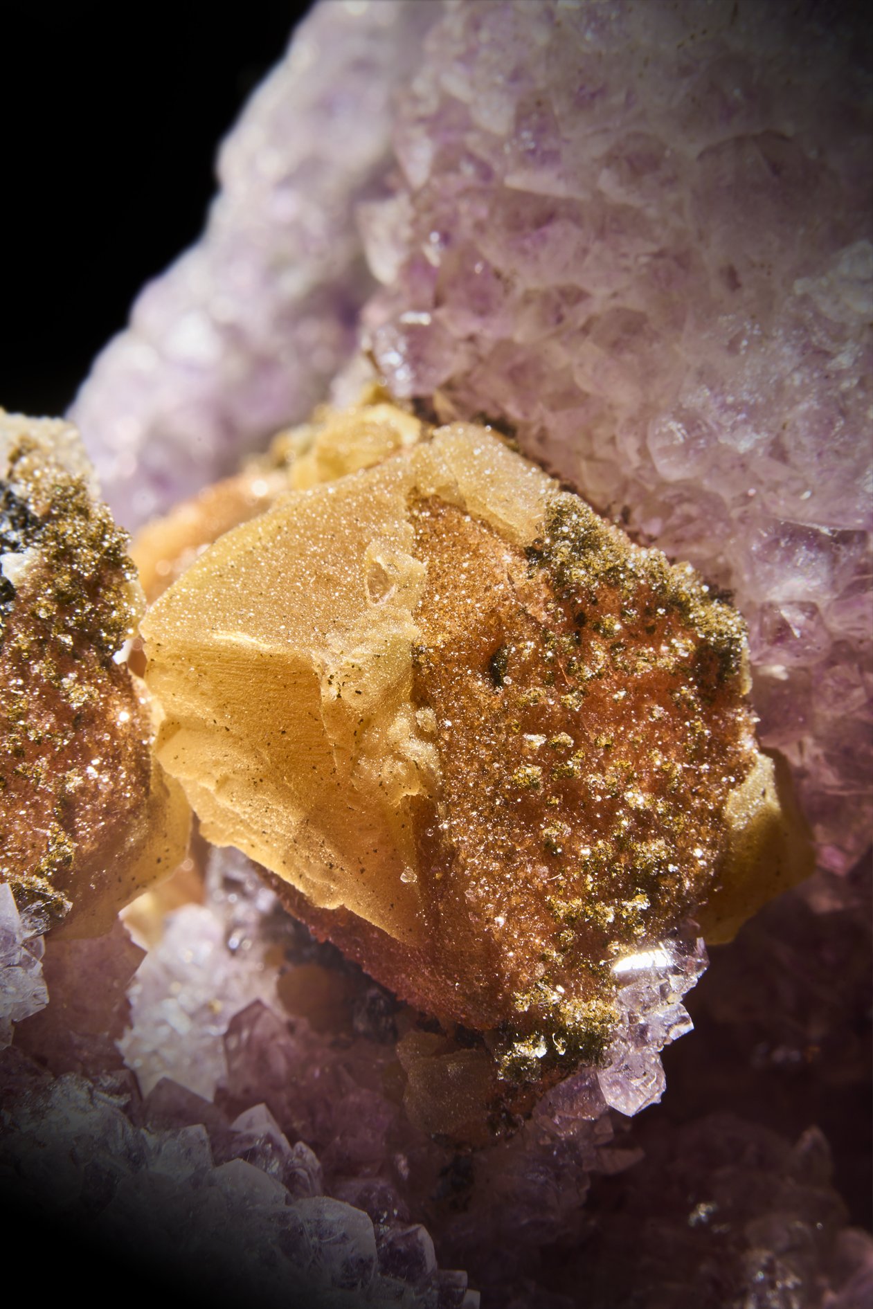 Image Description: A front angle view of a purple amethyst freeform piece with multiple calcite formations.