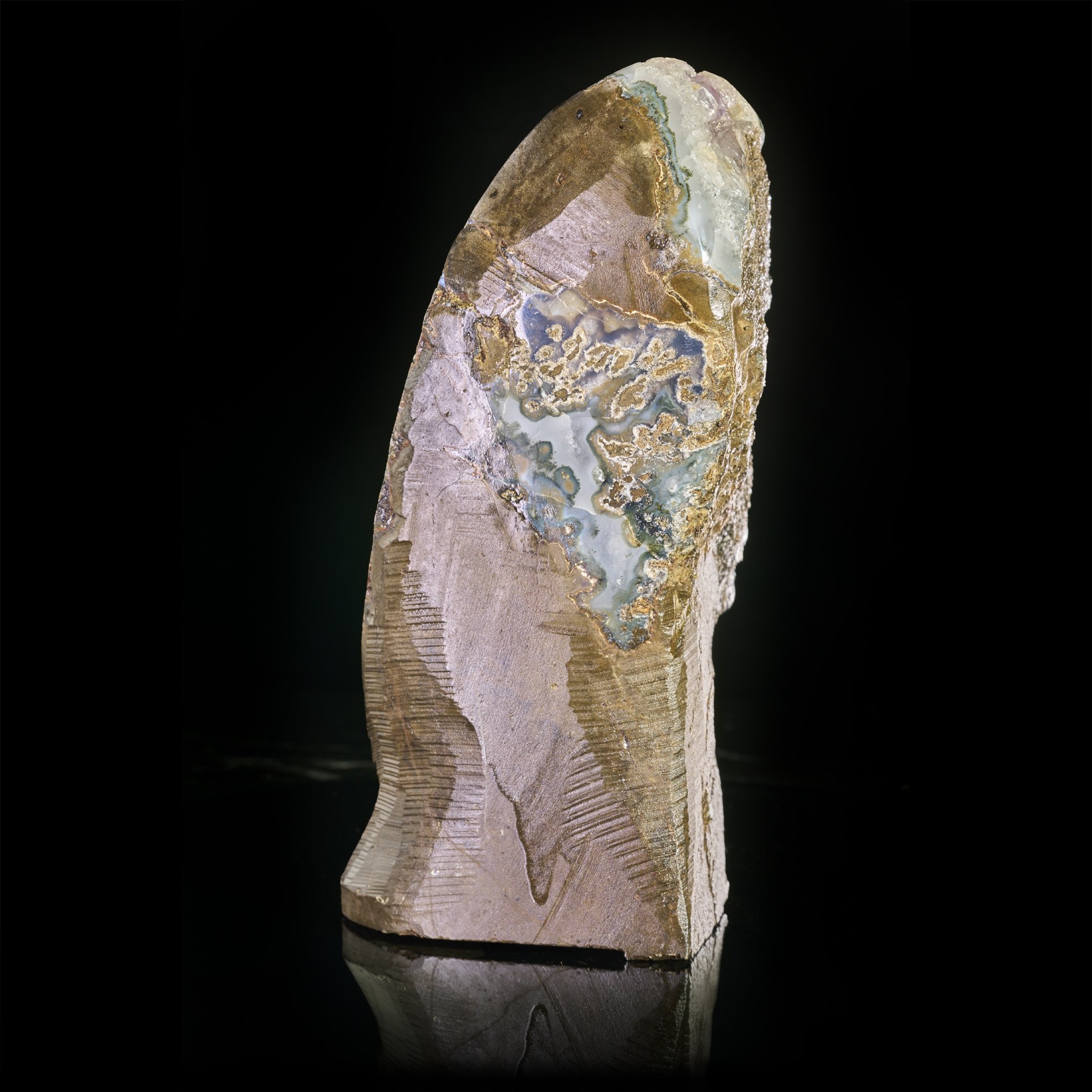 Image Description: A side angle view of a purple amethyst freeform piece with calcite formation.