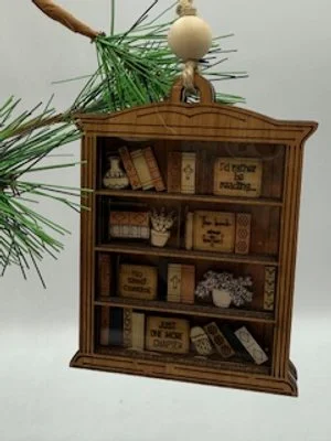 image of a wood Christmas ornament with a shape of a library