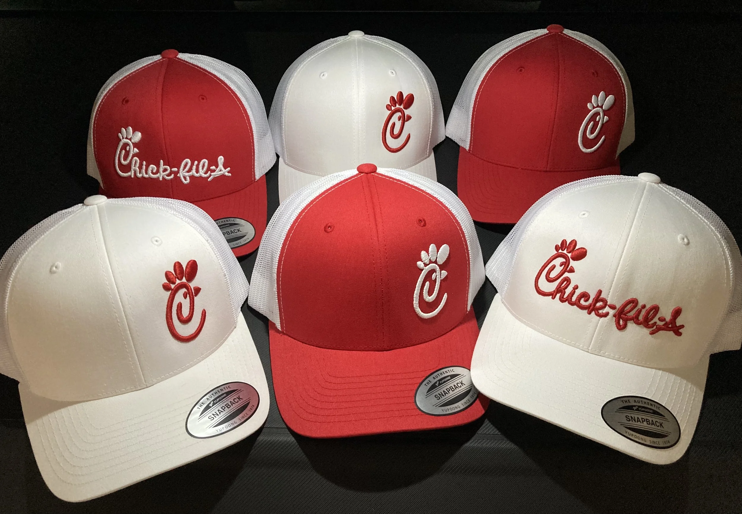 Branded hats with embroidered company logo