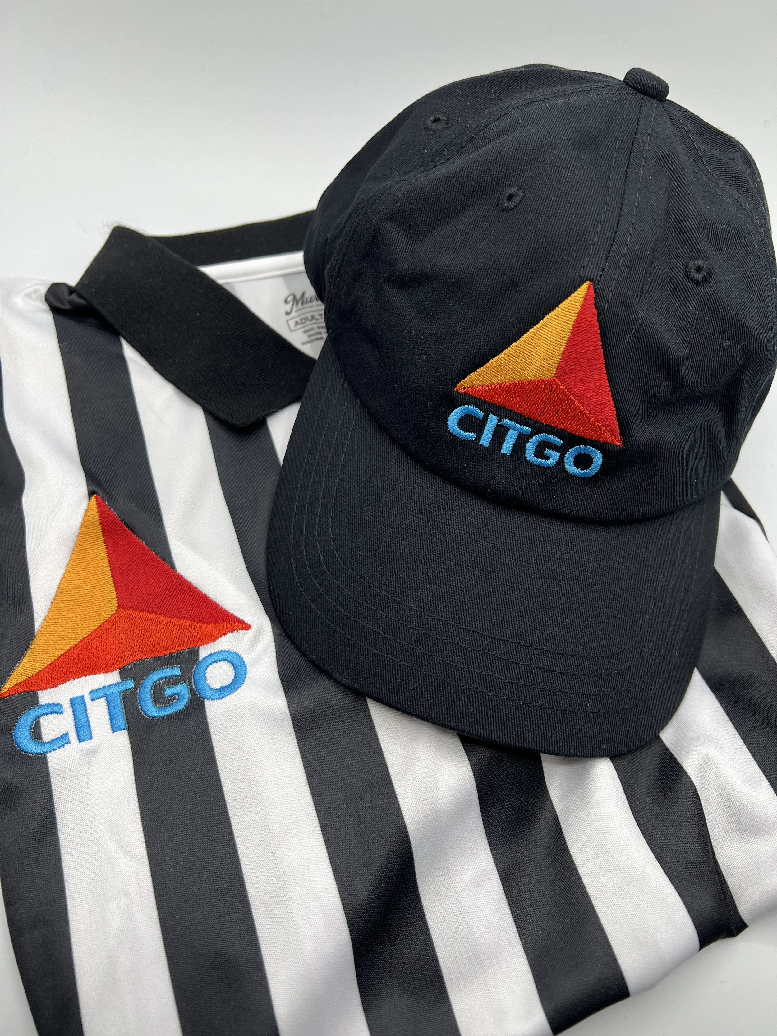 Business logo embroidered on shirt and hat