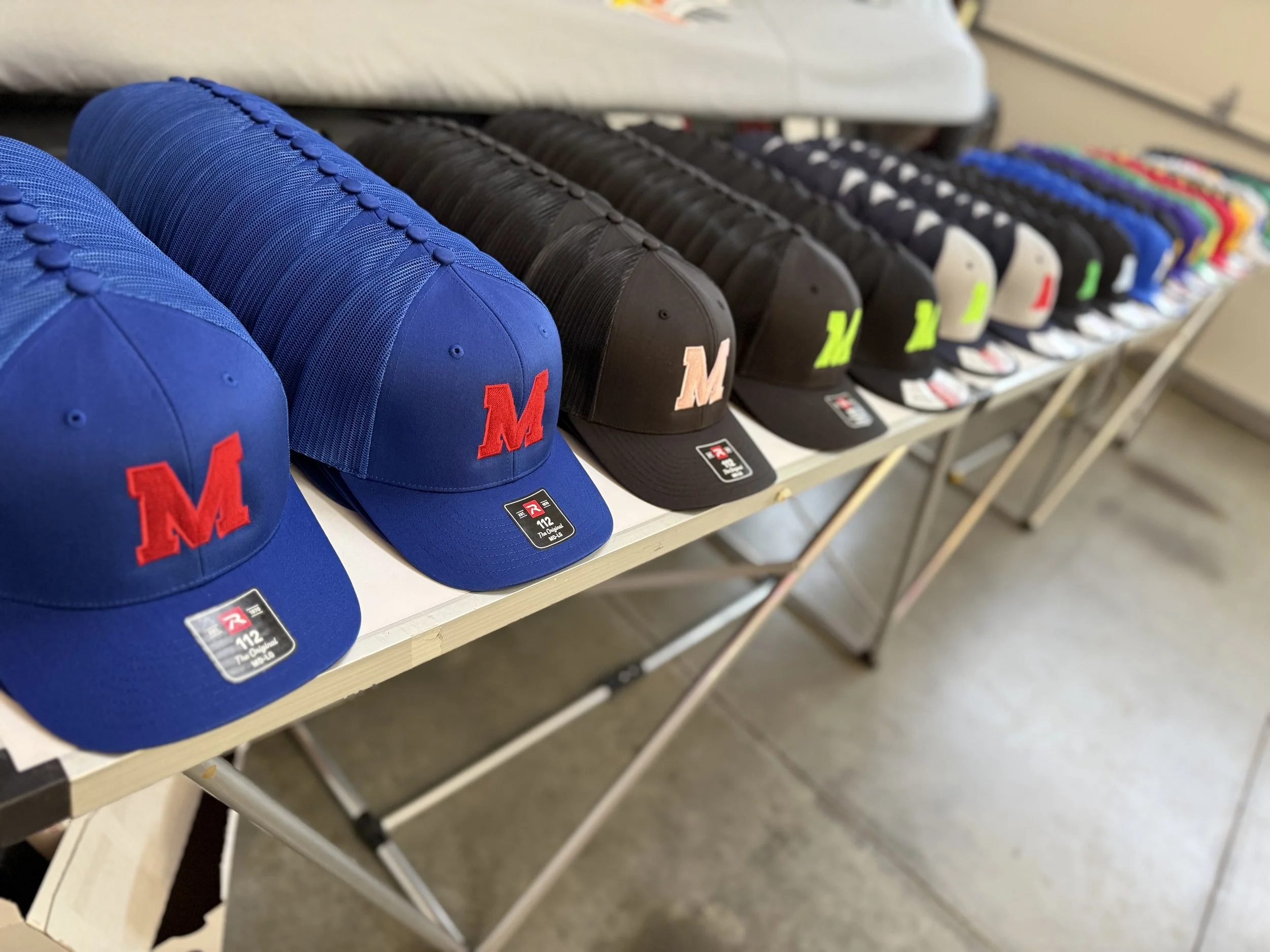 Custom embroidered youth baseball hats with clean logo placement for team uniforms
